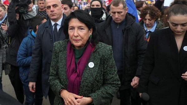 <div class="paragraphs"><p>Participants, including Georgia's President Salome Zourabichvili, walk during a procession in support of the country's membership in the European Union, in Tbilisi, Georgia.</p></div>