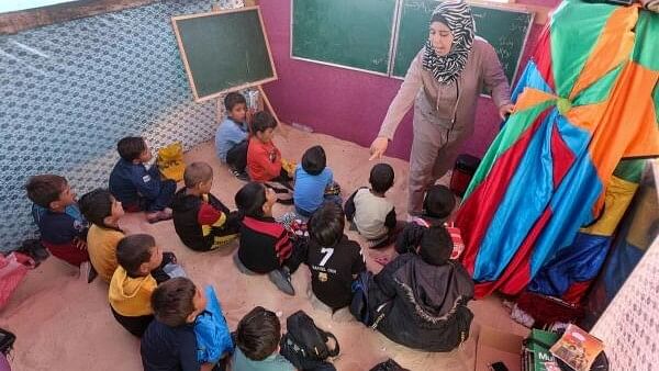 <div class="paragraphs"><p>Palestinian students study in a makeshift tent camp as schools remain closed due to Israel's military offensive, amid the ongoing conflict between Israel and the Palestinian Islamist group Hamas, in Khan Younis, southern Gaza Strip, April 28, 2024.</p></div>