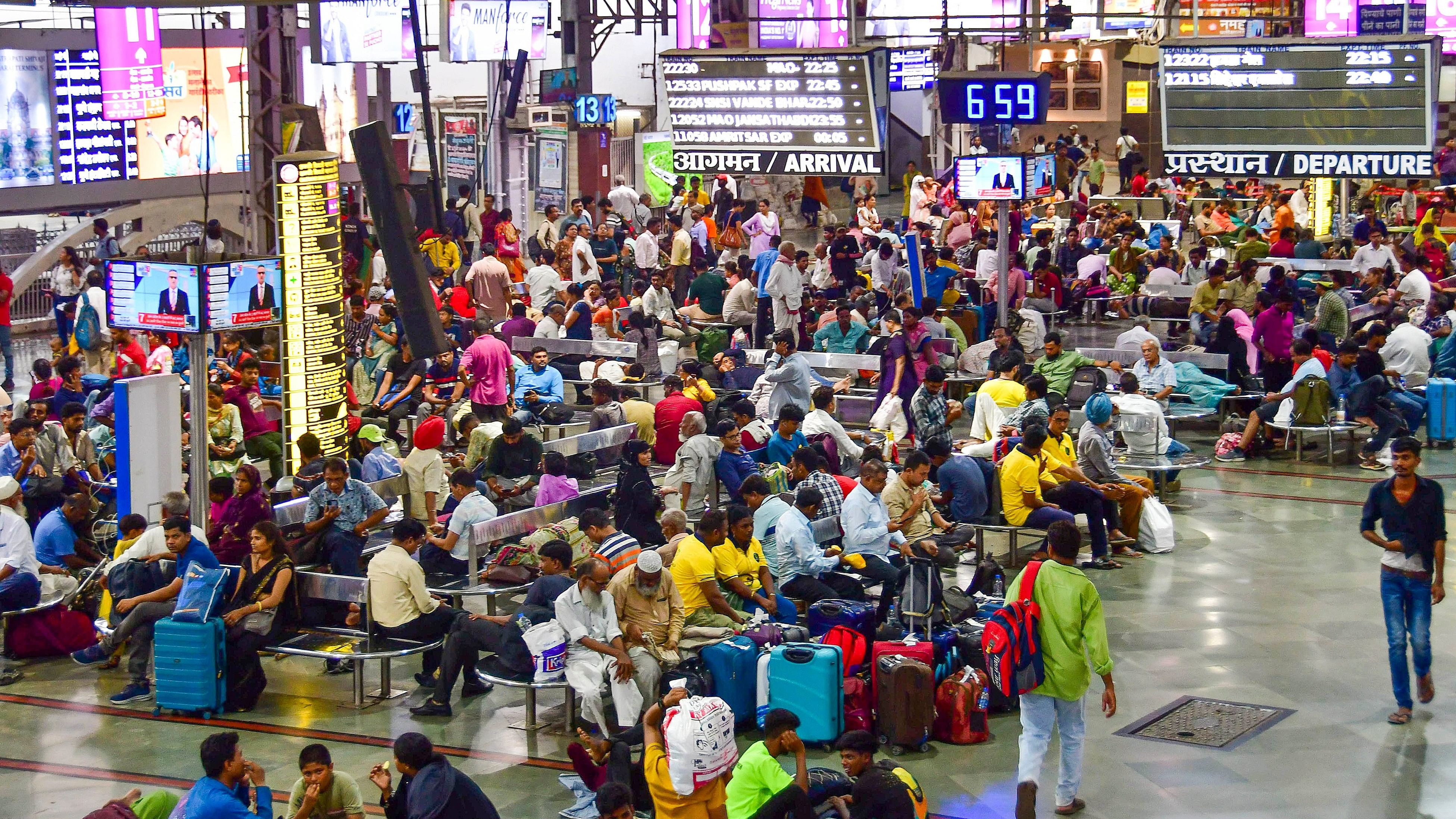 <div class="paragraphs"><p>Passengers wait after trains were short-terminated for the extension of platform numbers 10 and 11 to accommodate 24-coach trains from the earlier 16 coaches, at CSMT, in Mumbai on Thursday, May 30, 2024. </p></div>