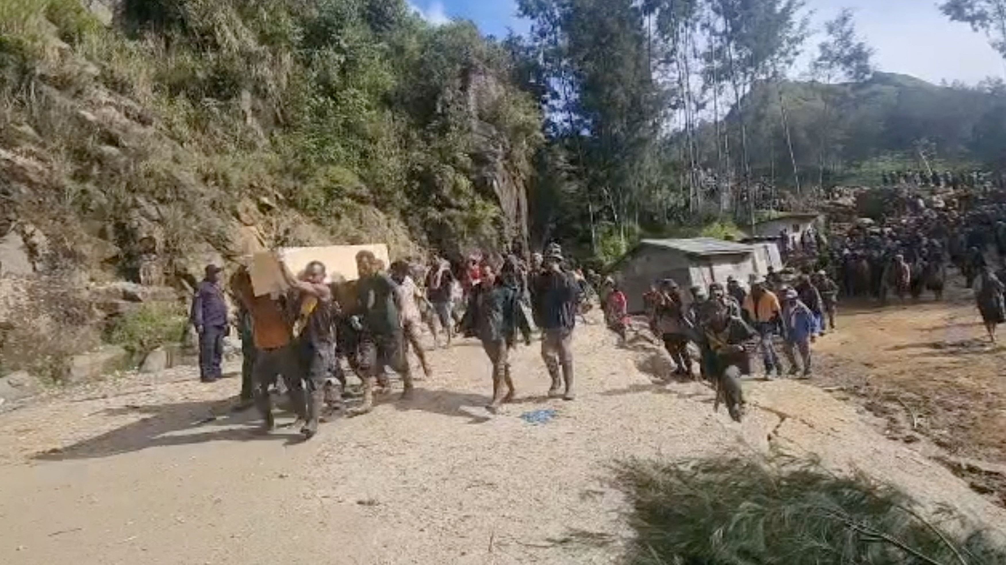 <div class="paragraphs"><p>People attend a funeral of a landslide victim in Yambali, Enga Province, Papua New Guinea, May 27, 2024, in this screengrab taken from a handout video. </p></div>