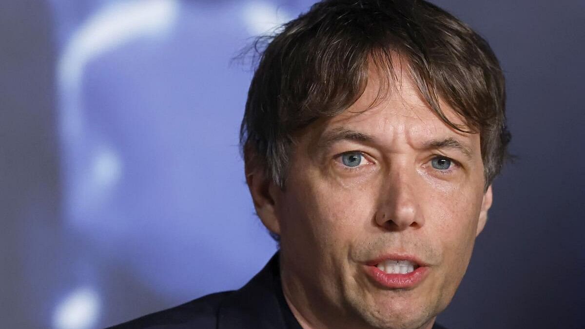 <div class="paragraphs"><p>Director Sean Baker gestures during a press conference at the 77th Cannes Film Festival in Cannes, France on May 22,.</p></div>