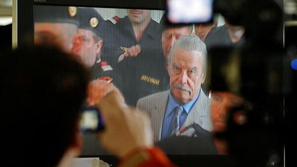 <div class="paragraphs"><p>File photo of journalists watching a TV screen inside the media tent as Austrian Josef Fritzl appeared in court during his trial in St. Poelten.</p></div>