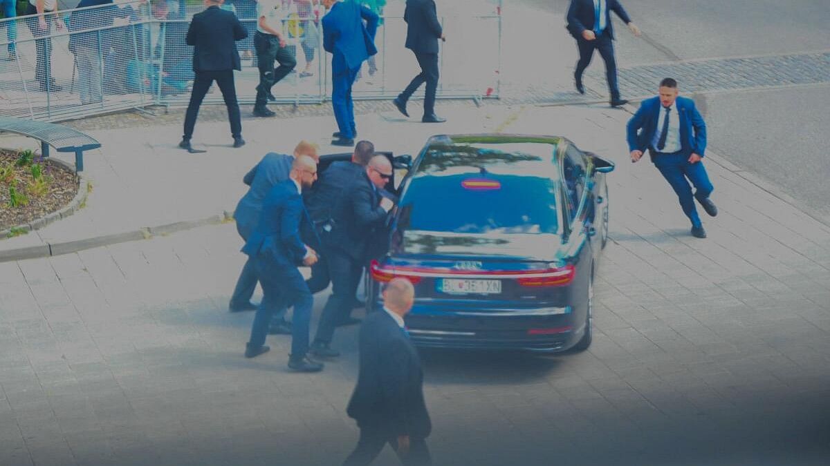 <div class="paragraphs"><p>Security officers move Slovak PM Robert Fico in a car after he was injured in a shooting incident, after a Slovak government meeting in Handlova, Slovakia.</p></div>