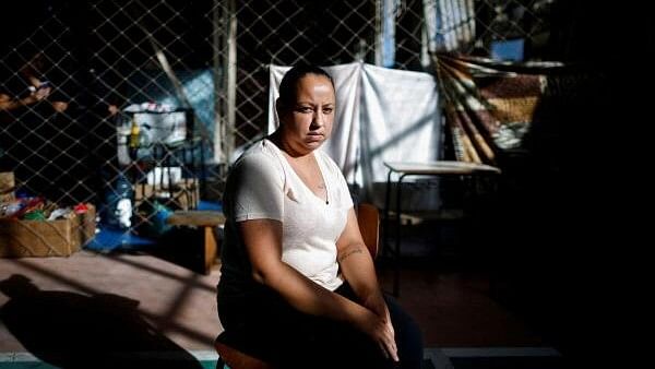 <div class="paragraphs"><p>Michelen Machado poses for a picture in a shelter at a university after her home was hit by the floods in Canoas, state of Rio Grande do Sul, Brazil.</p></div>