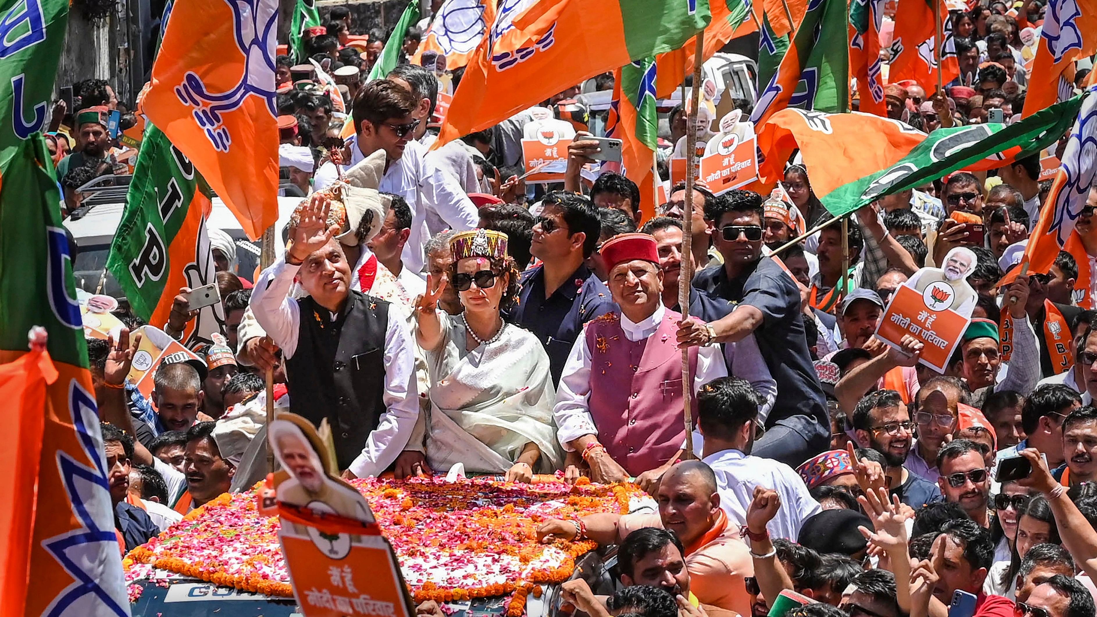 <div class="paragraphs"><p>BJP candidate Kangana Ranaut with former Himachal Pradesh Chief Minister Jai Ram Thakur and state President Rajiv Binadal during her nomination filing roadshow for Lok Sabha polls , in Mandi, Tuesday, May 14, 2024. </p></div>