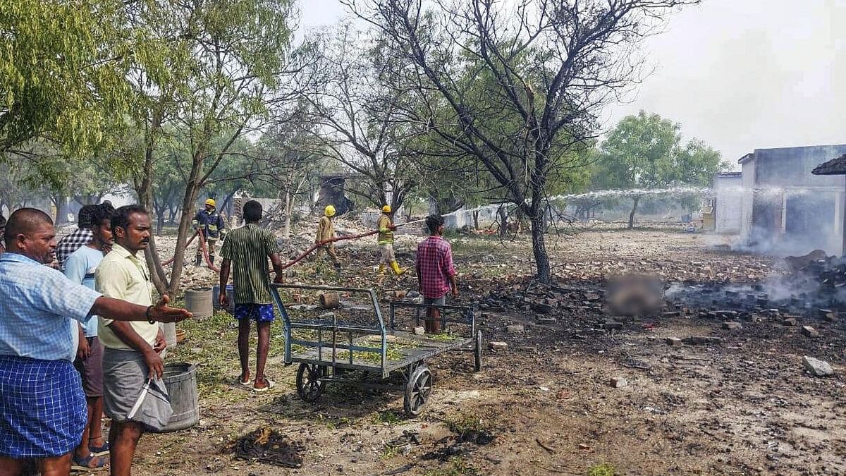 <div class="paragraphs"><p>Firefighters douse fire after a firecracker blast at a fireworks-manufacturing unit, in Sivakasion Thursday, May 9, 2024. </p></div>