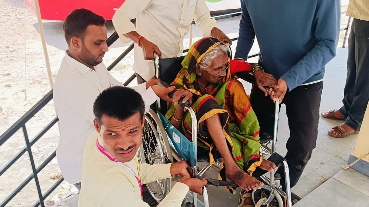 Gundabai, 105, arrives to cast her vote at Kosam village in Bidar district.