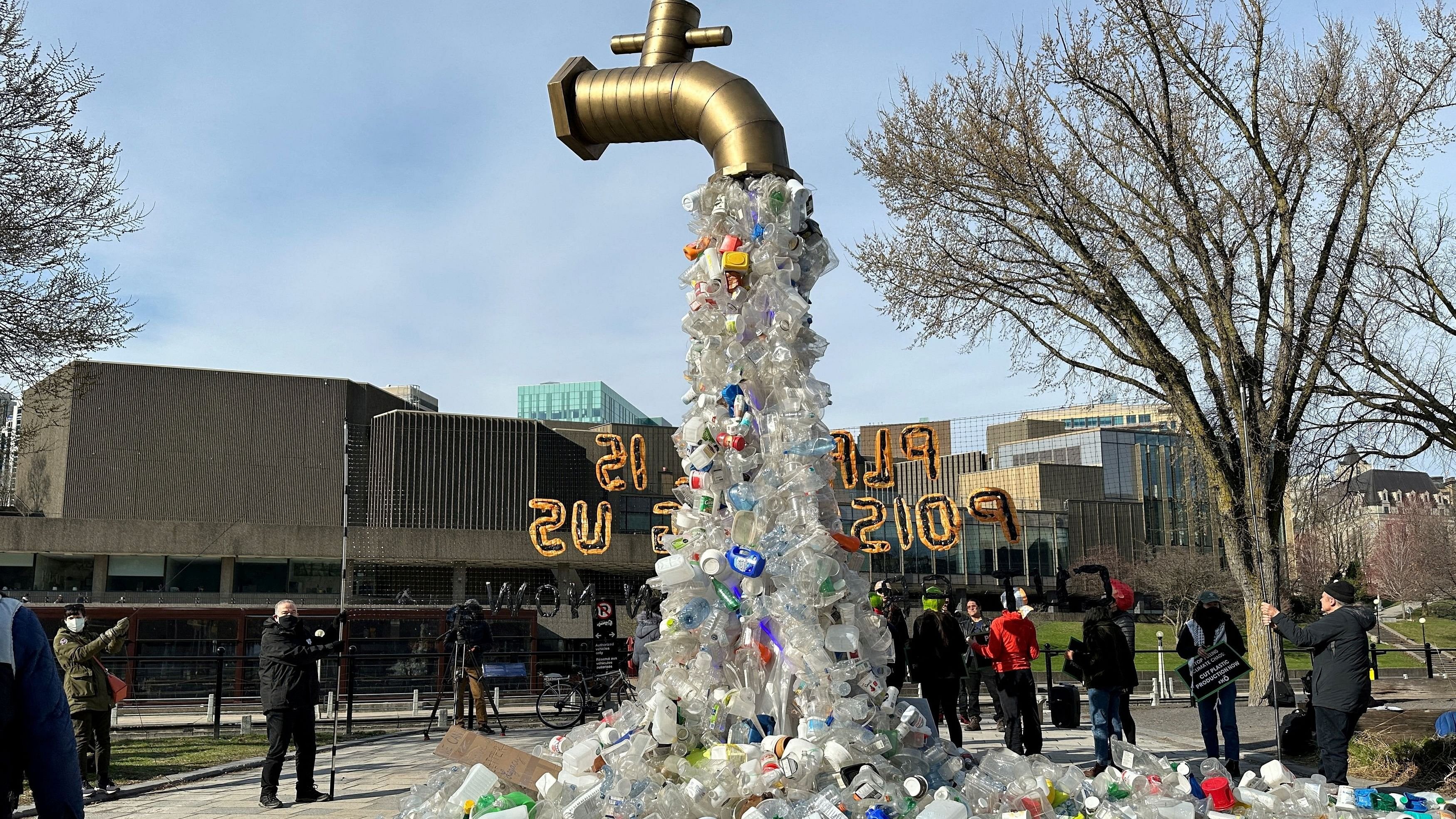 <div class="paragraphs"><p>A prop depicting a water tap with cascading plastic bottles is displayed by activists near the Shaw Centre venue of penultimate negotiations for the first-ever global plastics treaty, in Ottawa, Ontario, Canada.</p></div>