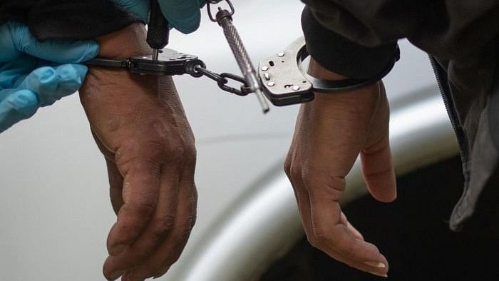 <div class="paragraphs"><p>Representative image showing two people handcuffed.</p></div>