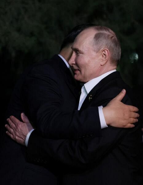 Hugs but not the full socialist-era kiss for Putin, Xi in Beijing