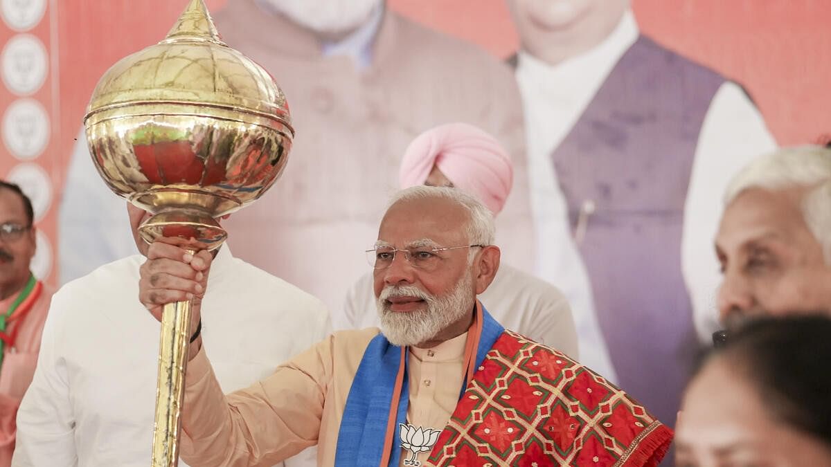 <div class="paragraphs"><p>Prime Minister Narendra Modi holds a mace at a public meeting for the last phase of Lok Sabha elections, in Hoshiarpur, Punjab, Thursday, May 30, 2024.</p></div>