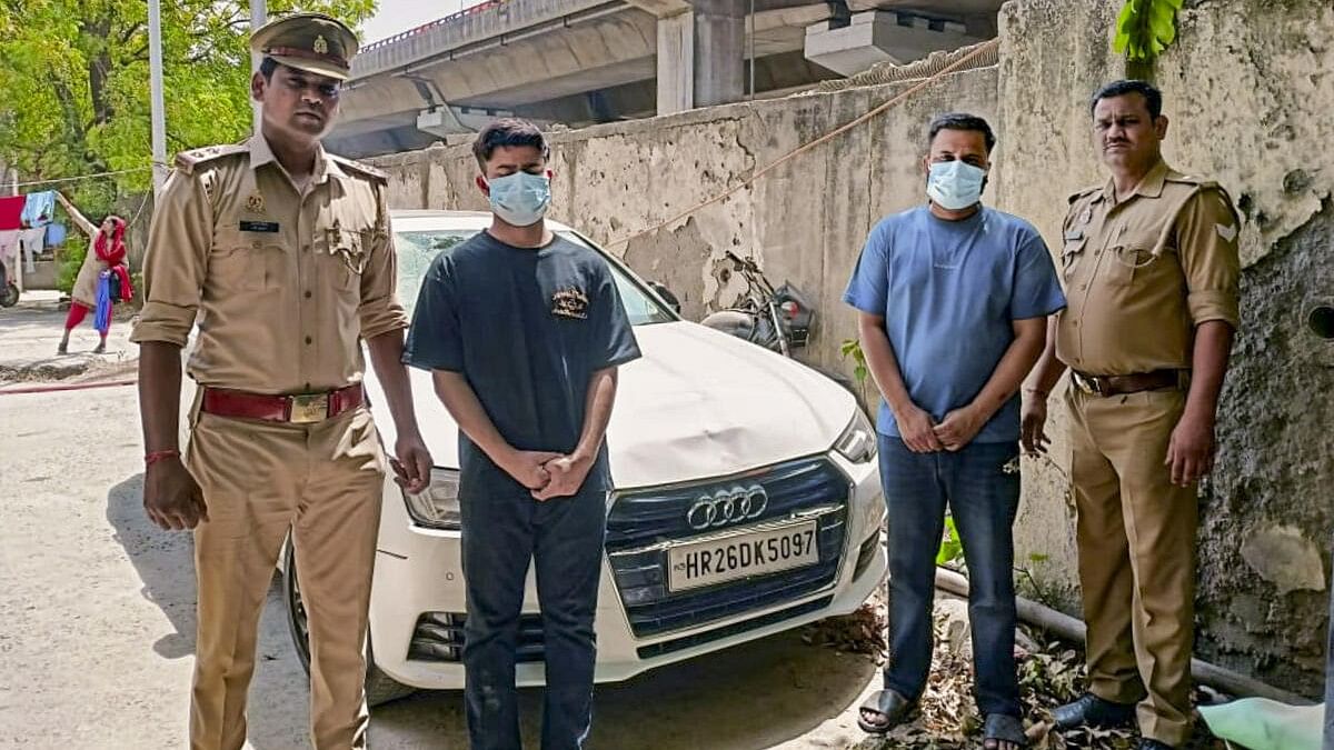 <div class="paragraphs"><p>Police with the two accused who were arrested in connection with the Audi hit-and-run accident in Sector 24 that killed an elderly man, in Noida.</p></div>