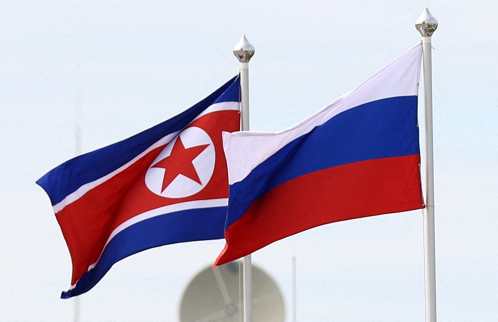 <div class="paragraphs"><p>Russian and North Korean flags.</p></div>