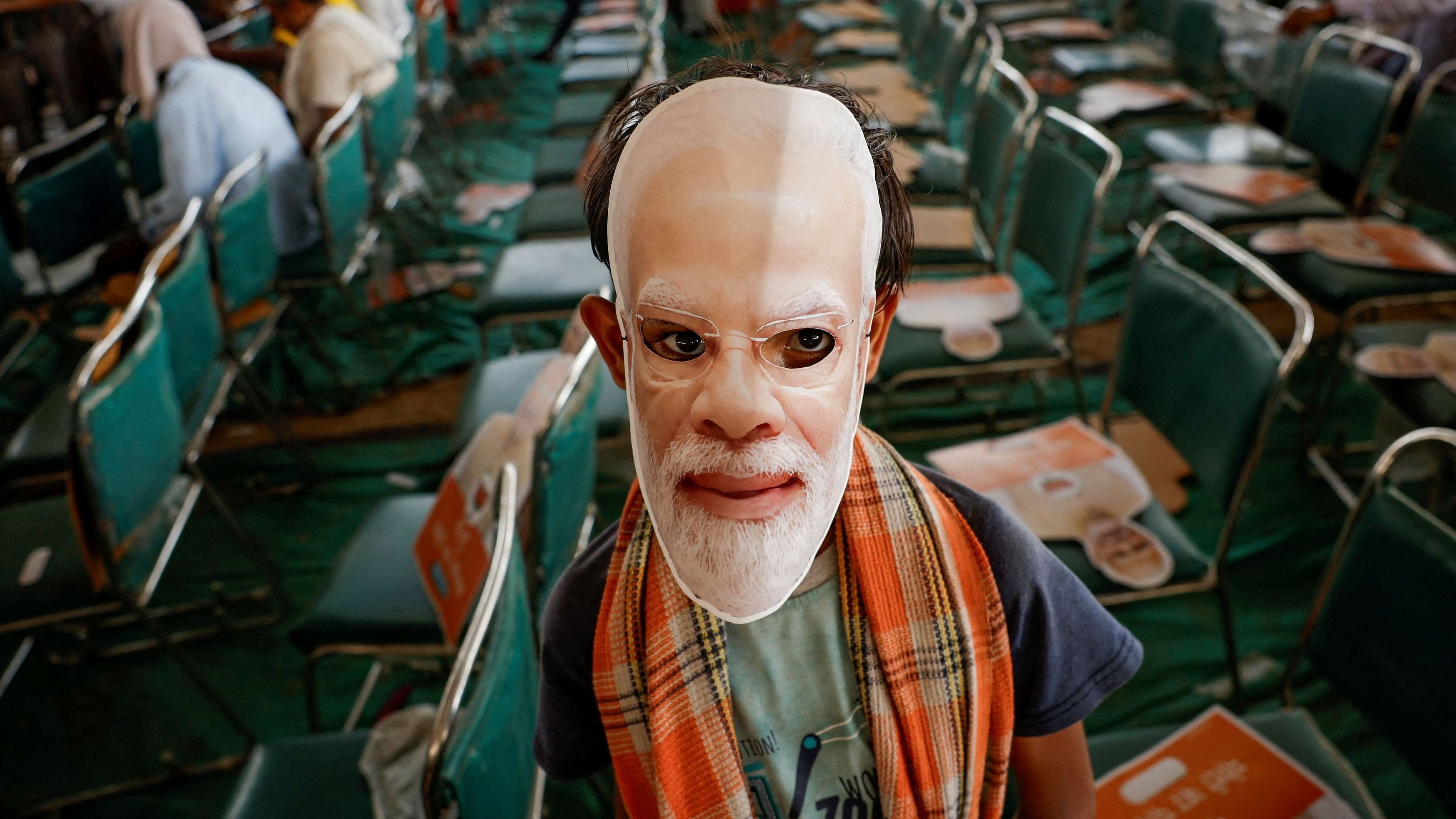 <div class="paragraphs"><p>A boy wears a mask depicting India's Prime Minister Narendra Modi during his election campaign rally, in New Delhi, India, May 22, 2024. </p></div>