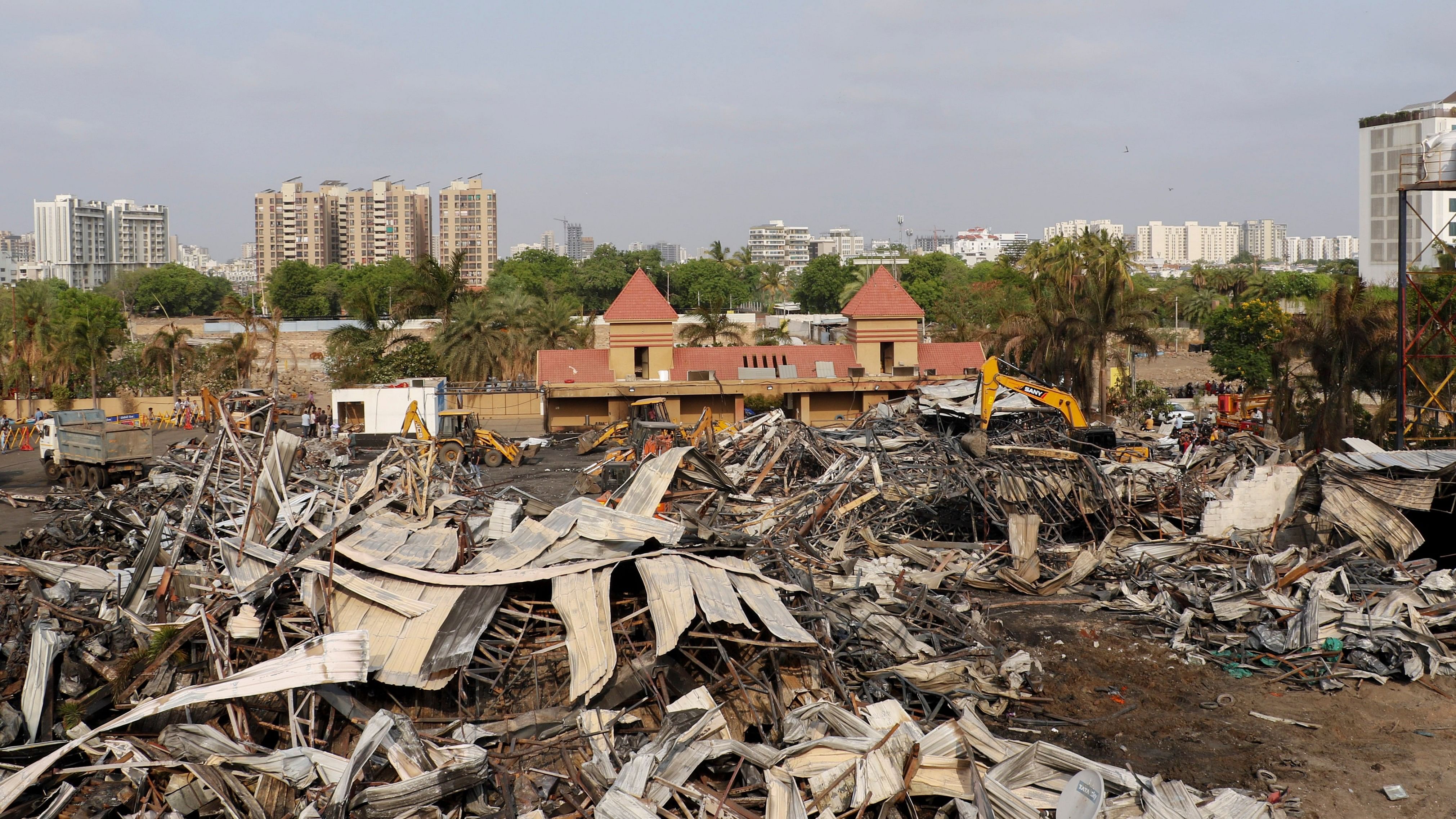 <div class="paragraphs"><p>Debris being removed from the game zone site where a major fire on Saturday evening killed at least 27 people and injured three, in Rajkot.</p></div>