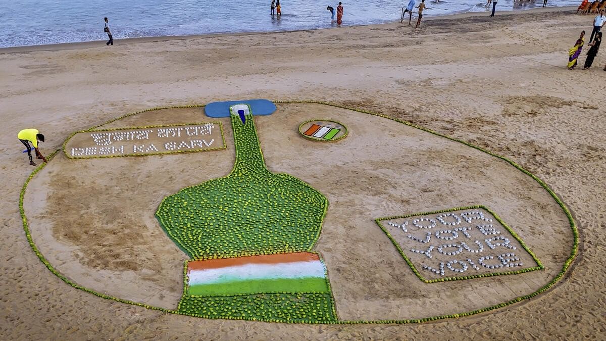 <div class="paragraphs"><p>Renowed sand artist Sudarsan Pattnaik creates a sand sculpture to spread voting awareness with the message 'Chunab Ka Parba, Desh ka Garv', at Puri beach.</p></div>