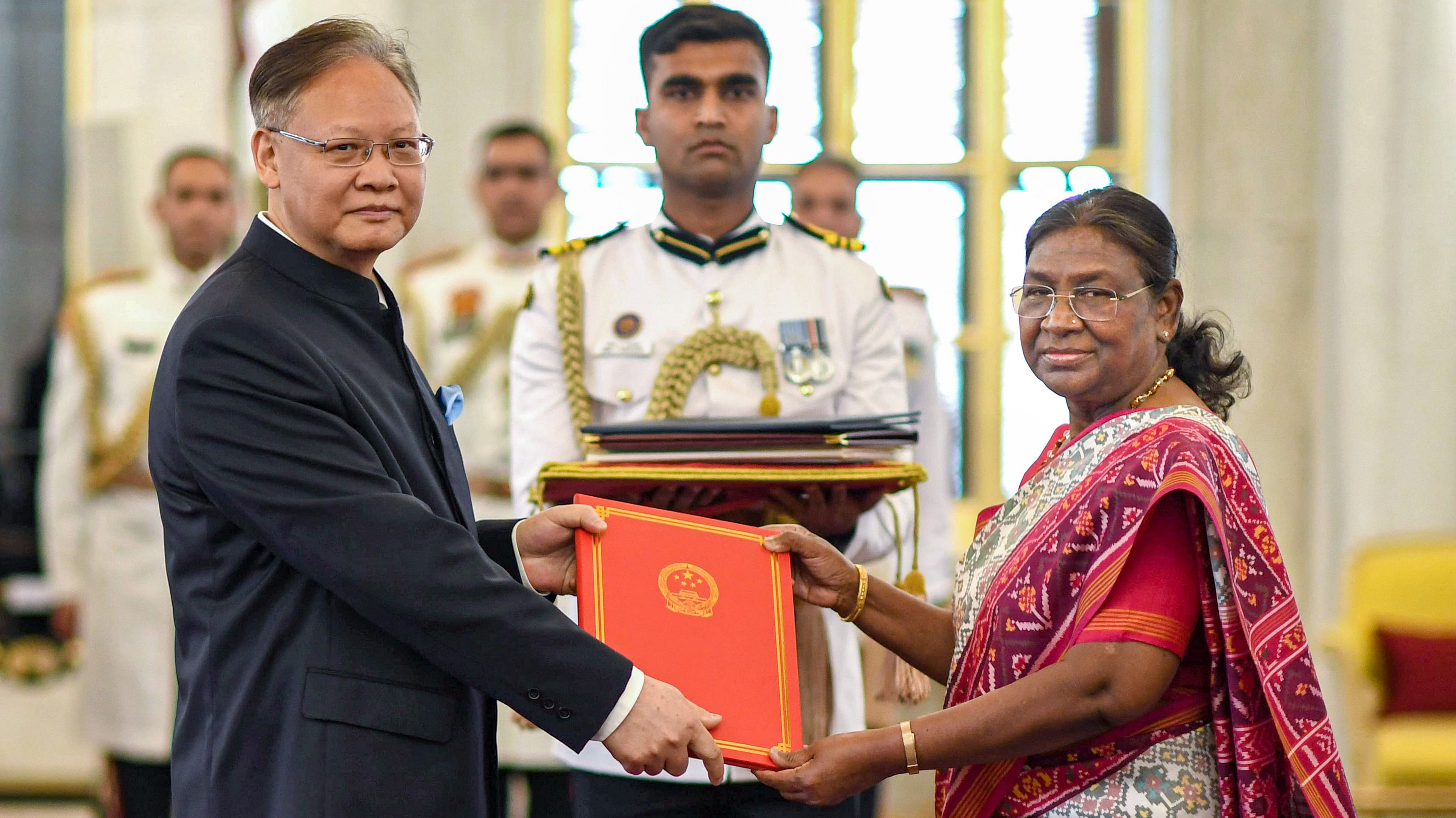 <div class="paragraphs"><p>President Droupadi Murmu accepts credentials from the Ambassador of the People’s Republic of China Xu Feihong during a ceremony at the Rashtrapati Bhavan, in New Delhi, Friday.</p></div>