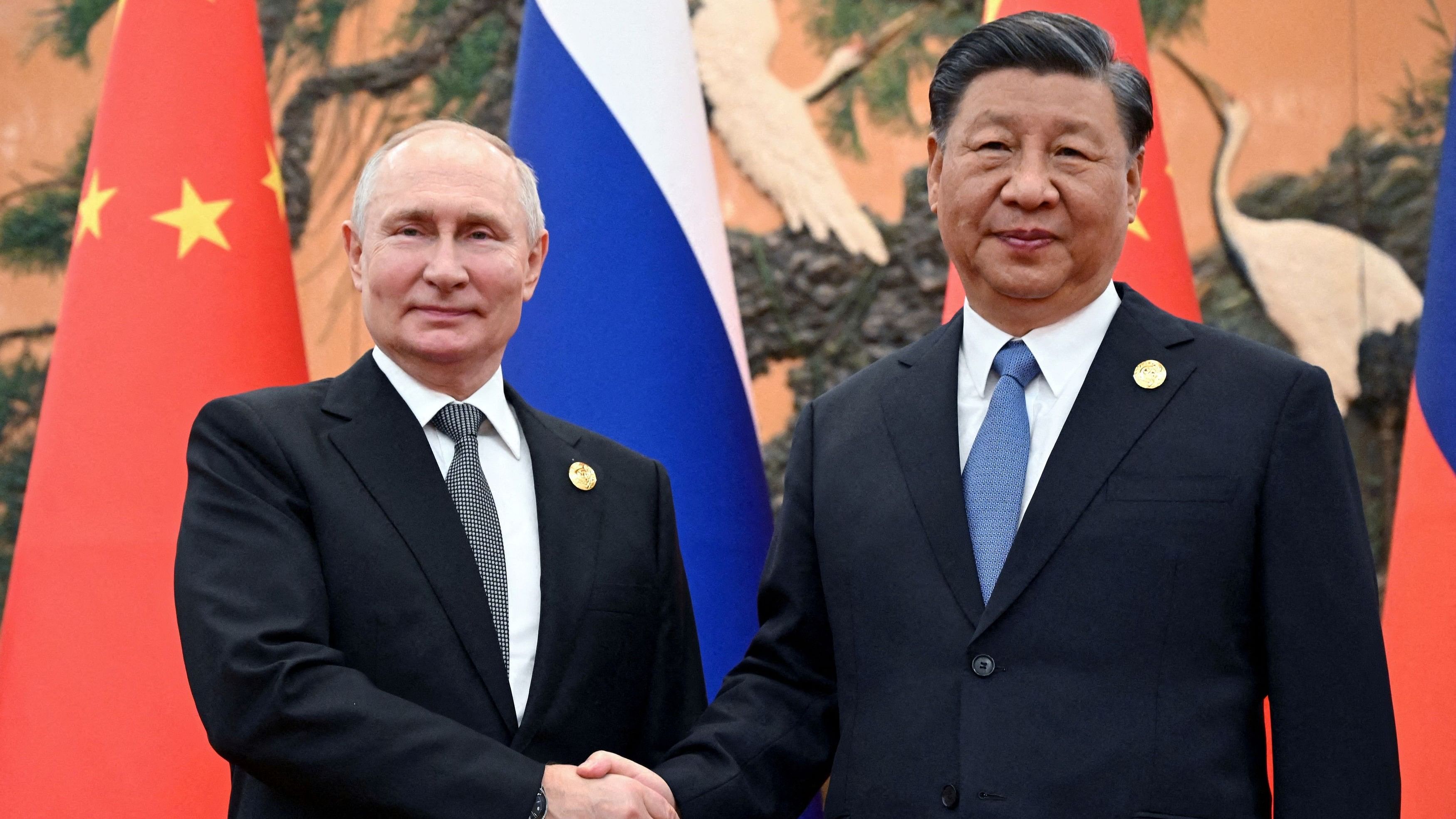 <div class="paragraphs"><p>Russian President Vladimir Putin shakes hands with Chinese President Xi Jinping during a meeting at the Belt and Road Forum in Beijing.</p></div>