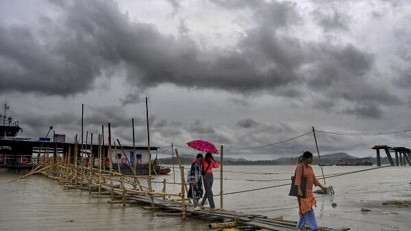 <div class="paragraphs"><p>Black clouds hover over the River Brahmputra in the aftermath of Cyclone Remal, in Guwahati, Monday, May 27, 2024. Ferry services between south and north Guwahati has been stopped for the safety of the regular passengers following the aftermath of cyclonic storm.</p></div>