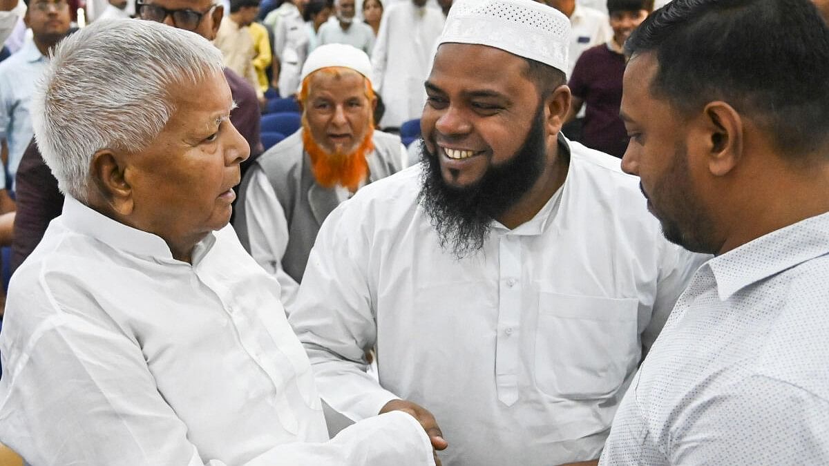 <div class="paragraphs"><p>RJD chief Lalu Prasad Yadav being greeted by MLCs during during their swearing-in ceremony, in Patna.</p></div>