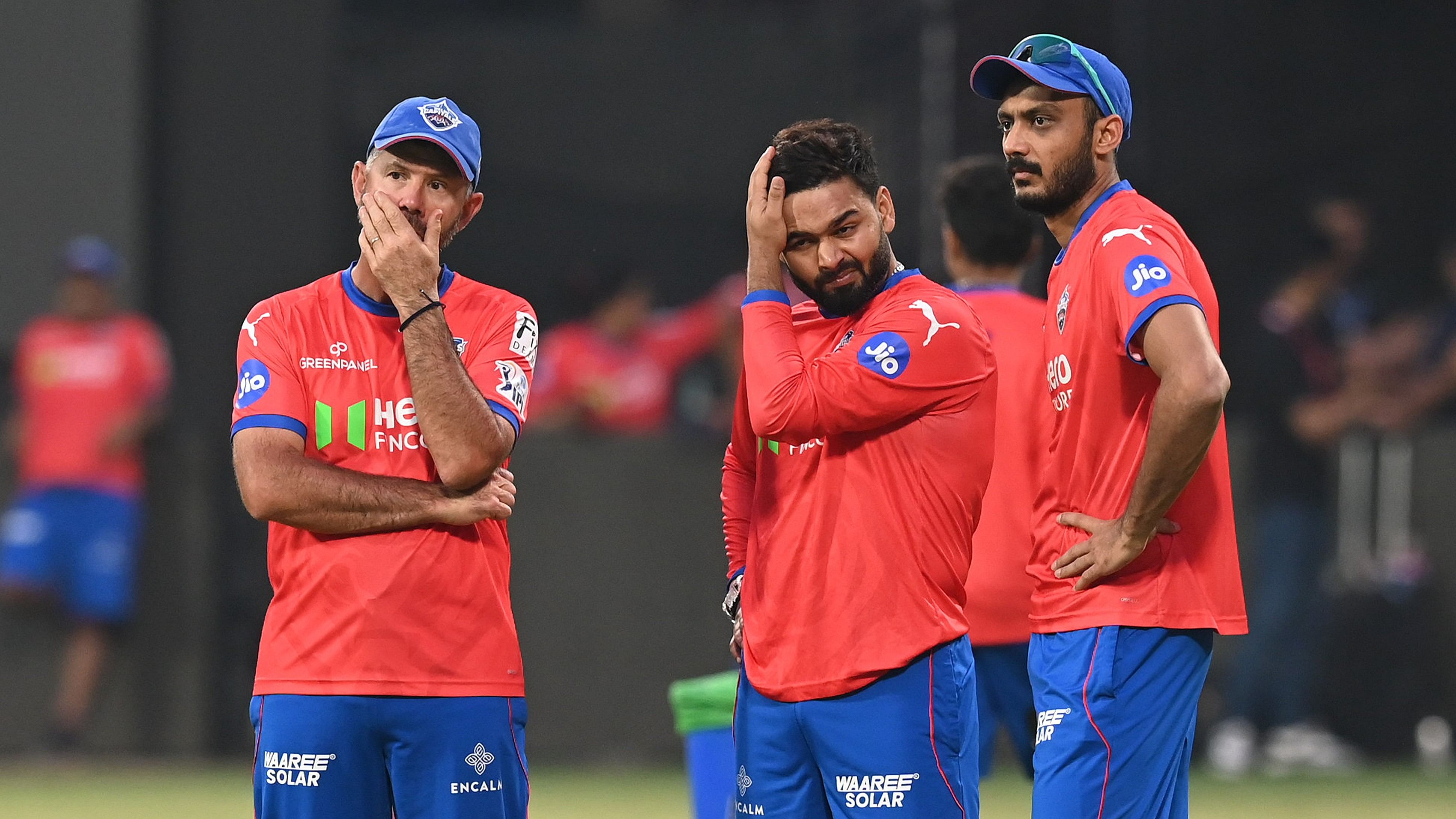 <div class="paragraphs"><p>Delhi Capitals head coach Ricky Ponting (left) chats with Rishabh Pant (centre) and Axar Patel during a practice session ahead of their game against Royal Challengers Bengaluru at M Chinnaswamy Stadium on Saturday. </p></div>