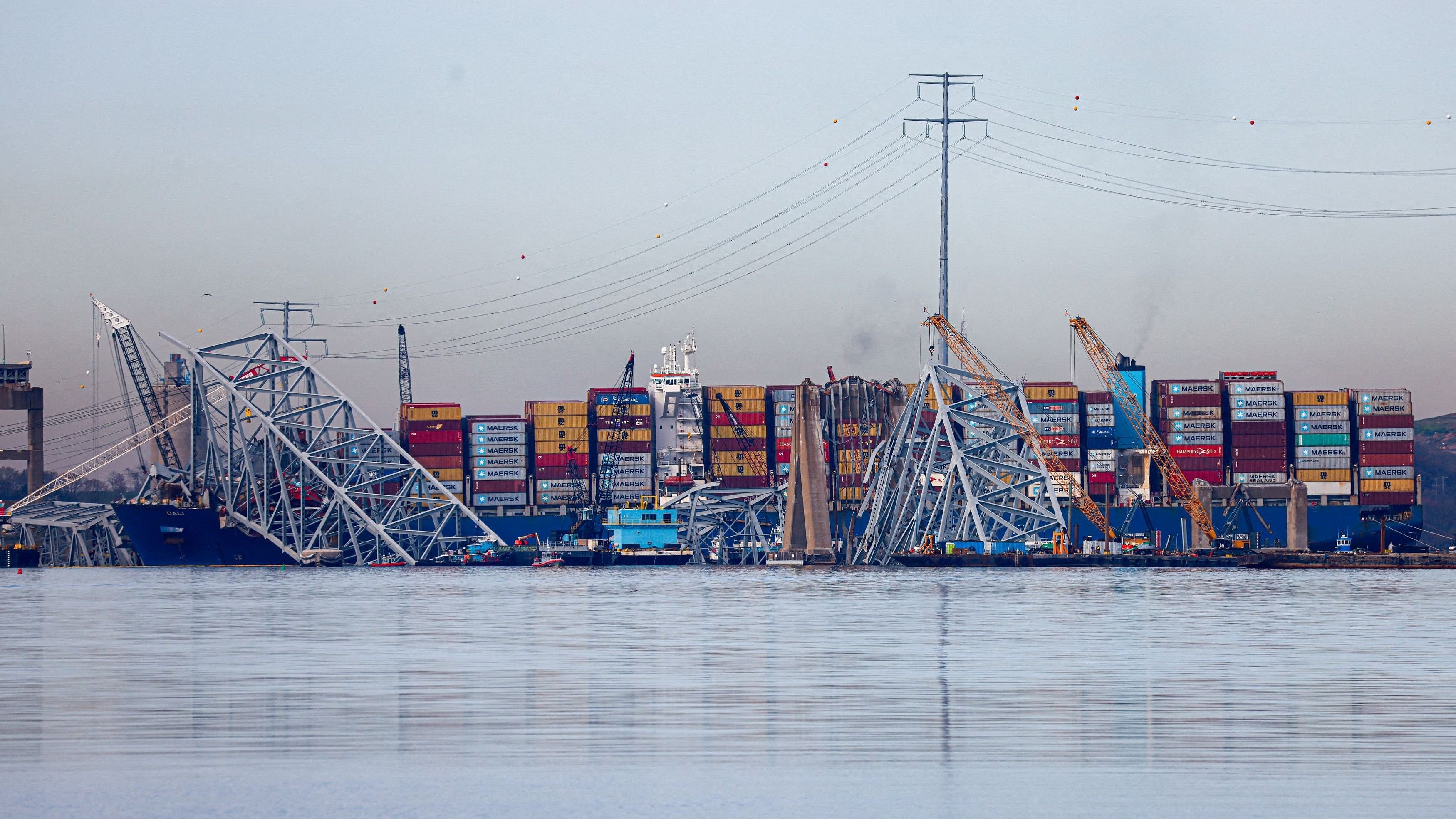 <div class="paragraphs"><p>Wreckage of the collapsed Francis Scott Key Bridge lies atop the container ship Dali as salvage work continues in Baltimore, Maryland, U.S., April 8, 2024. </p></div>