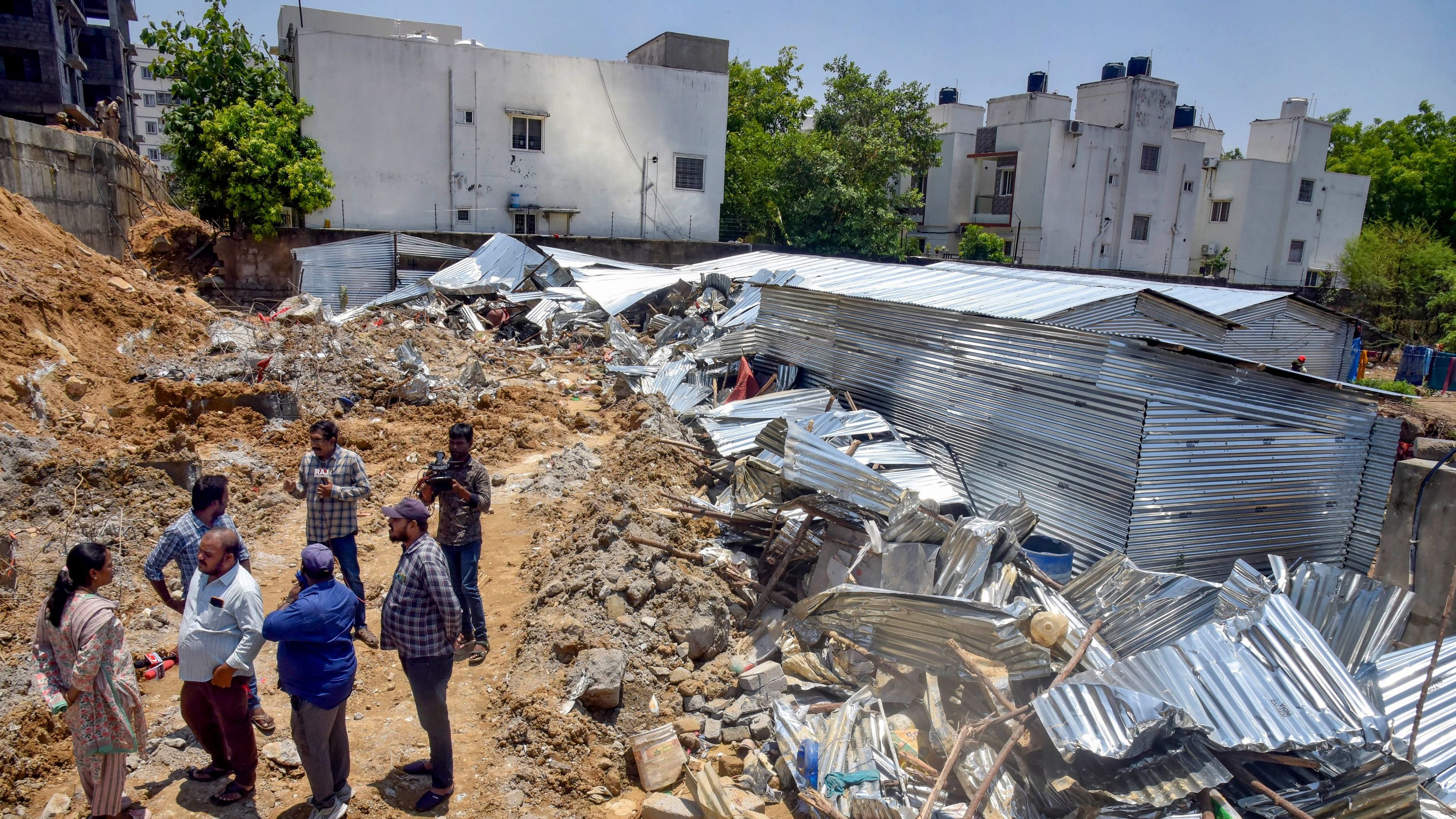 <div class="paragraphs"><p>Media persons near the site where a retaining wall of an under construction apartment collapsed due to heavy rains, in Bachupally area of Medchal Malkajgiri district, Hyderabad,.</p></div>