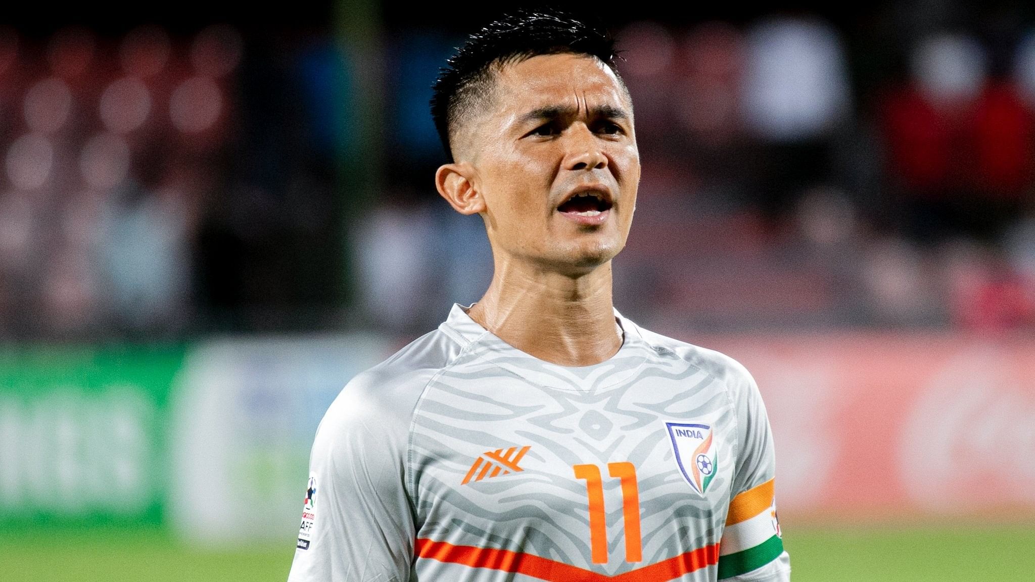 <div class="paragraphs"><p>Sunil Chhetri singing the national anthem at the start of an Indian national team football match.</p></div>