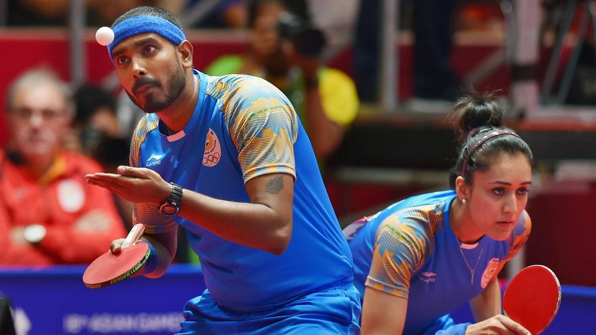 <div class="paragraphs"><p>India's Achantab Sharath(L) and Manika Batra during a mixed-double table tennis match.</p></div>