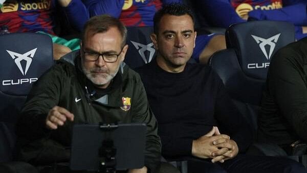 <div class="paragraphs"><p>Barcelona coach Xavi and assistant coach Oscar Hernandez.</p></div>