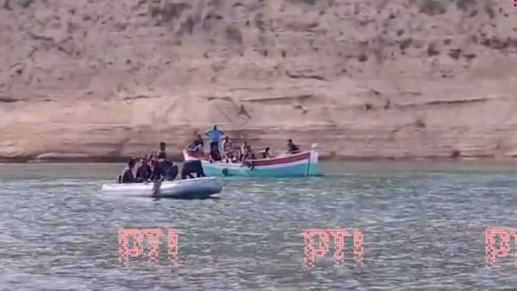 <div class="paragraphs"><p>Screengrab of the video showing NDRF personnel searching for people in Narmada river at Poicha, Gujarat, on May 15, 2024.</p></div>