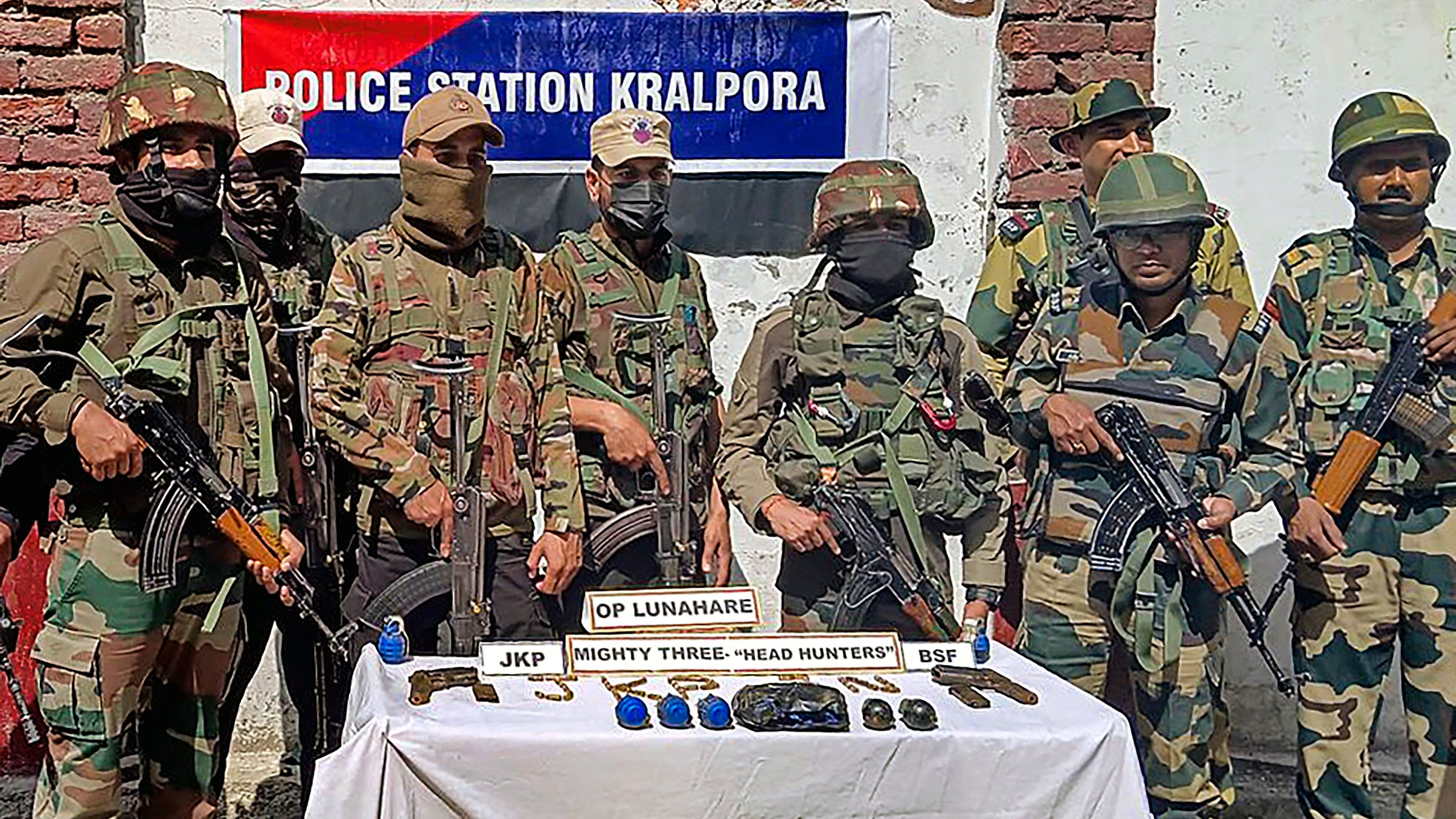 <div class="paragraphs"><p>Kupwara: Security personnel with recovered cache of arms and ammunition at Kralpora, in Kupwara district, Jammu and Kashmir on Thursday, May 16, 2024. </p></div>