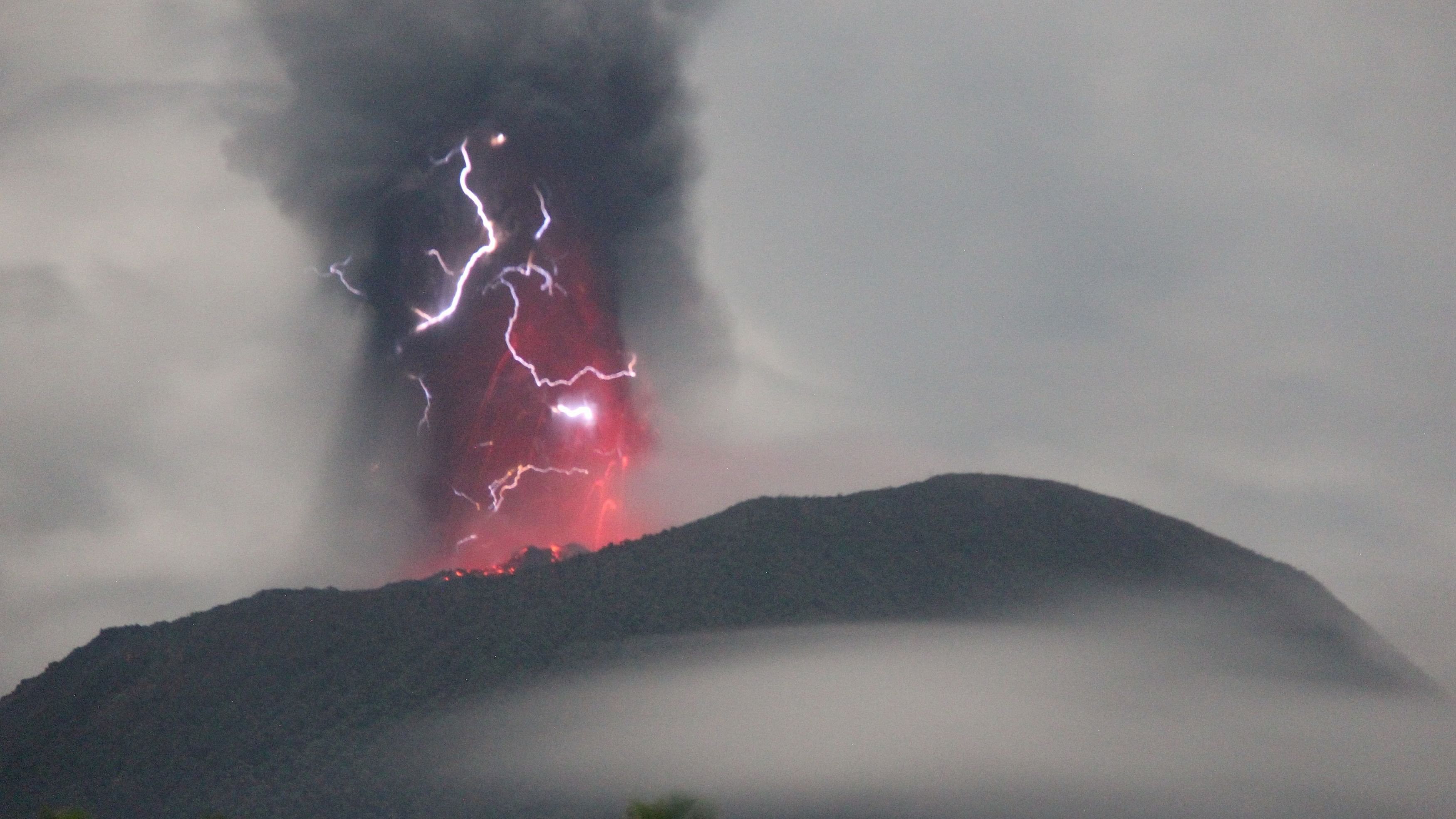 <div class="paragraphs"><p>Lightning appears amid a storm as Mount Ibu spews volcanic material during an eruption, as seen from Gam Ici in West Halmahera, North Maluku province, Indonesia, on May 18, 2024.</p></div>