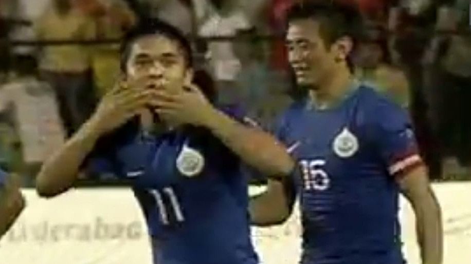 <div class="paragraphs"><p>A young Sunil Chhetri blowing a kiss, with Indian football legend Bhaichung Bhutia behind him.</p></div>