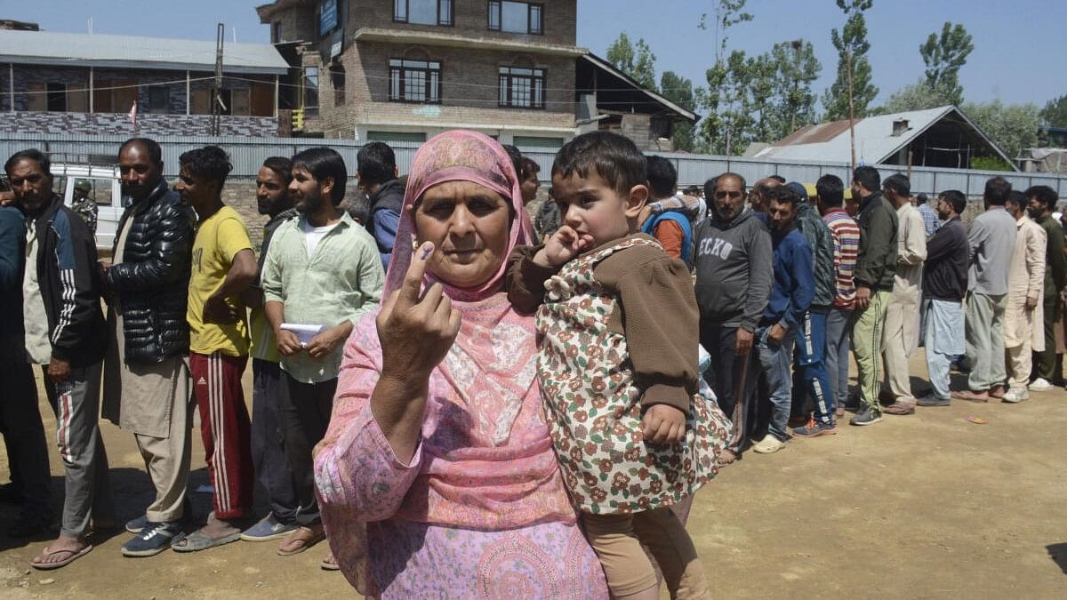 <div class="paragraphs"><p>An elderly voter shows her ink marked finger after casting her vote at a polling booth during the 5th phase of elections, in Baramulla district.&nbsp;</p></div>