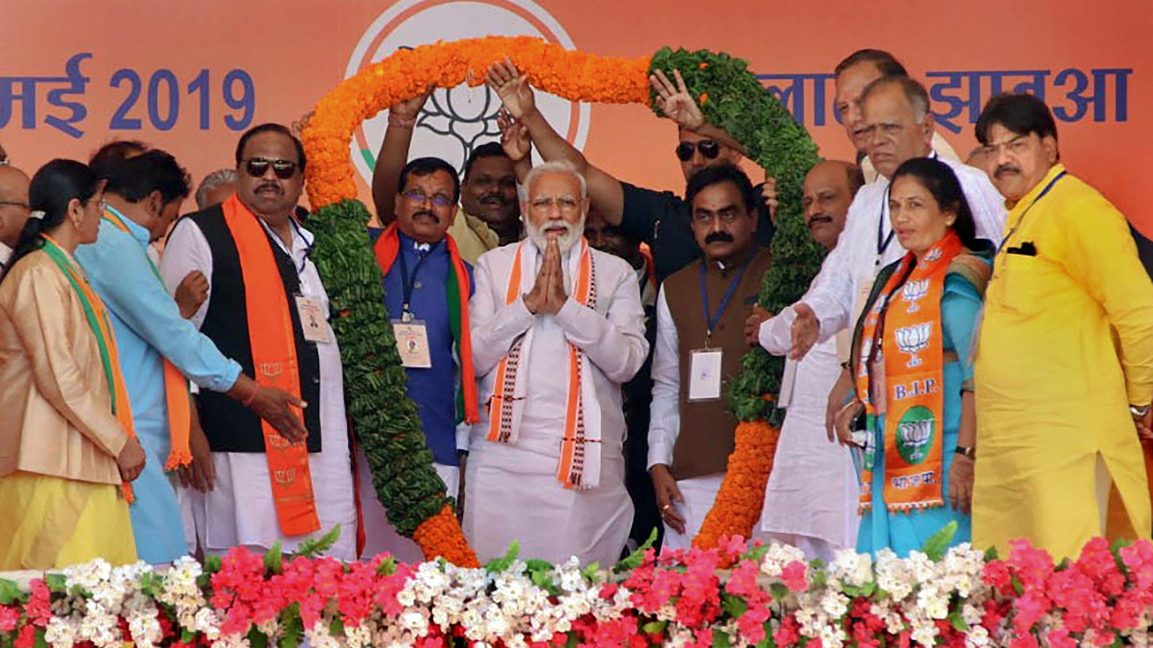 <div class="paragraphs"><p>Prime Minister Narendra Modi being garlanded during an election campaign rally for the ongoing Lok Sabha polls, in Ratlam.</p></div>