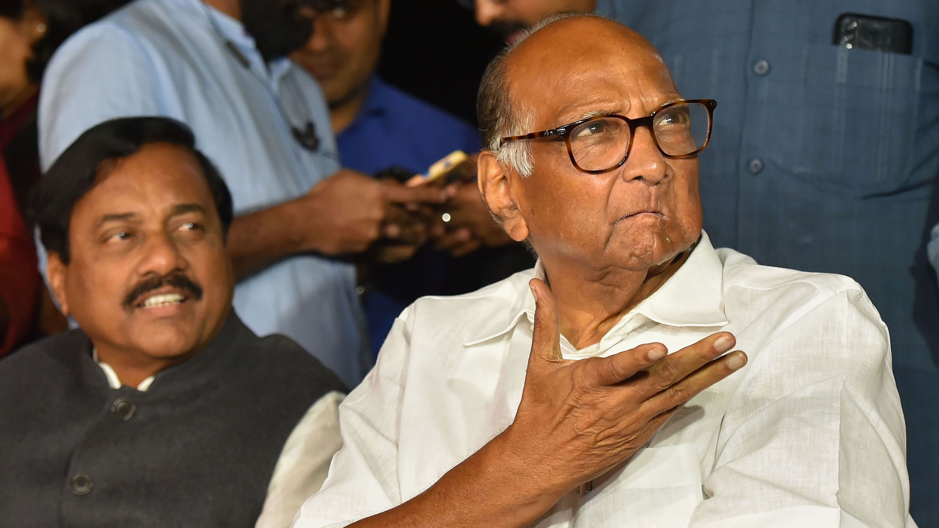 <div class="paragraphs"><p>NCP chief Sharad Pawar with NCP MP Sunil Tatkare.</p></div>