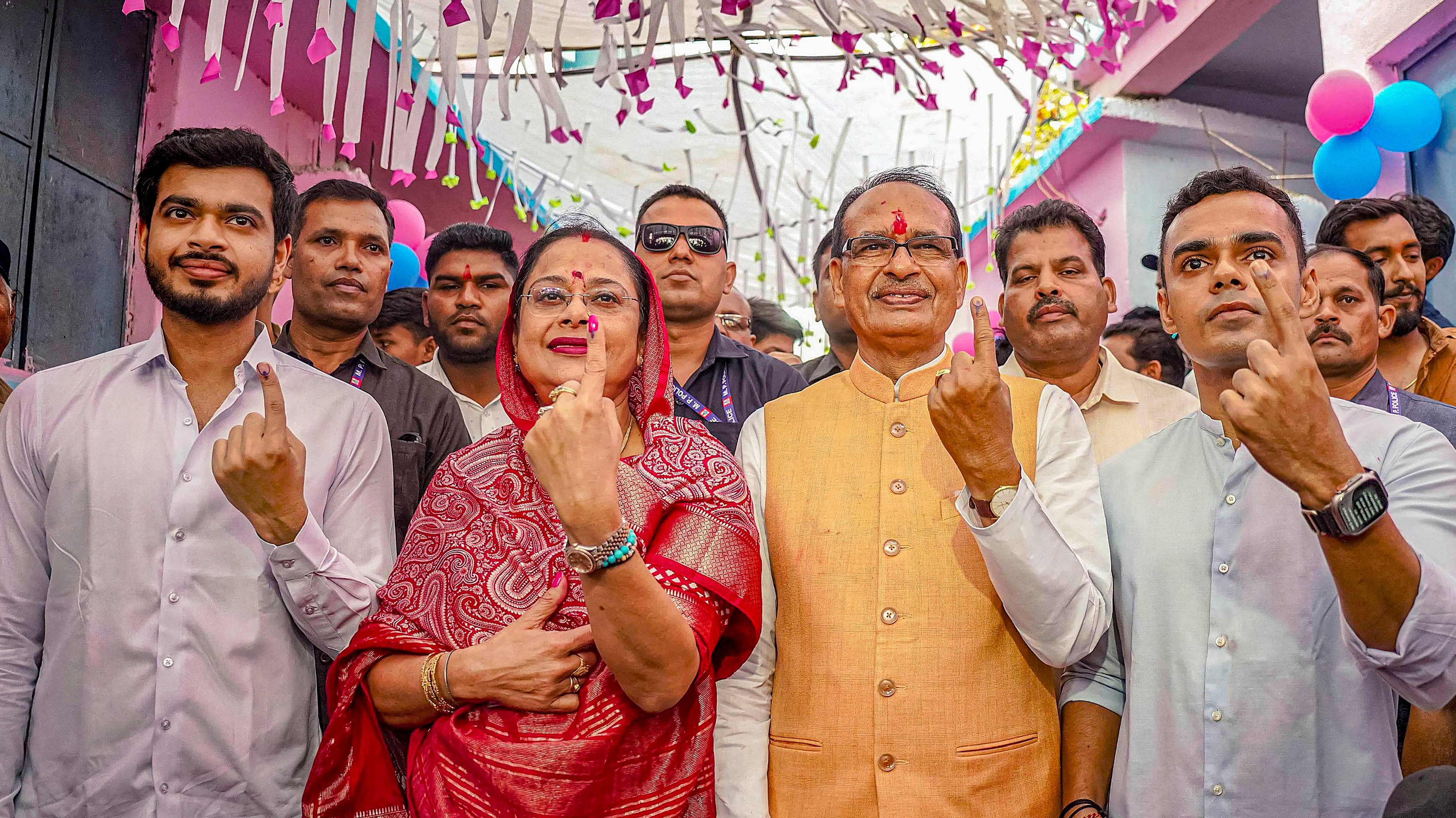 <div class="paragraphs"><p>Former Madhya Pradesh Chief Minister Shivraj Singh Chouhan with his wife Sadhna Singh and sons  shows inked fingers after casting votes  in Sehore district on Tuesday.</p></div>