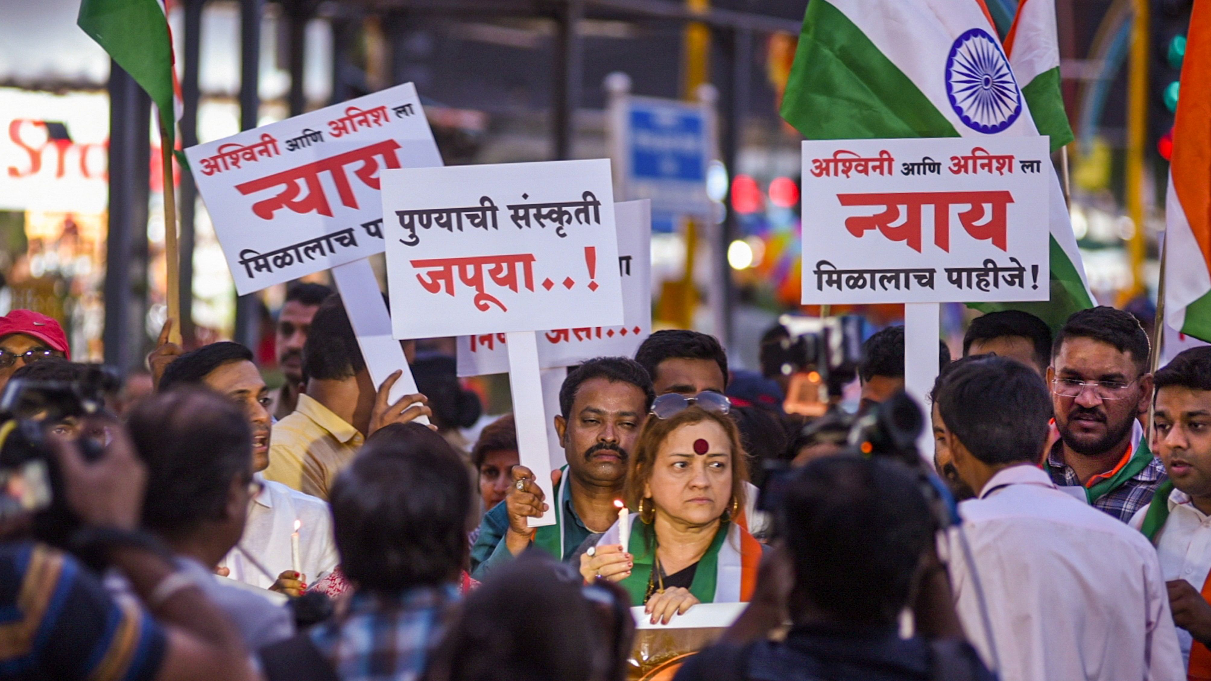 <div class="paragraphs"><p>People take part in a candlelight vigil march to pay condolences to motorbikers who were killed after being knocked down by a porsche car, in Pune, Friday, May 24, 2024.</p></div>