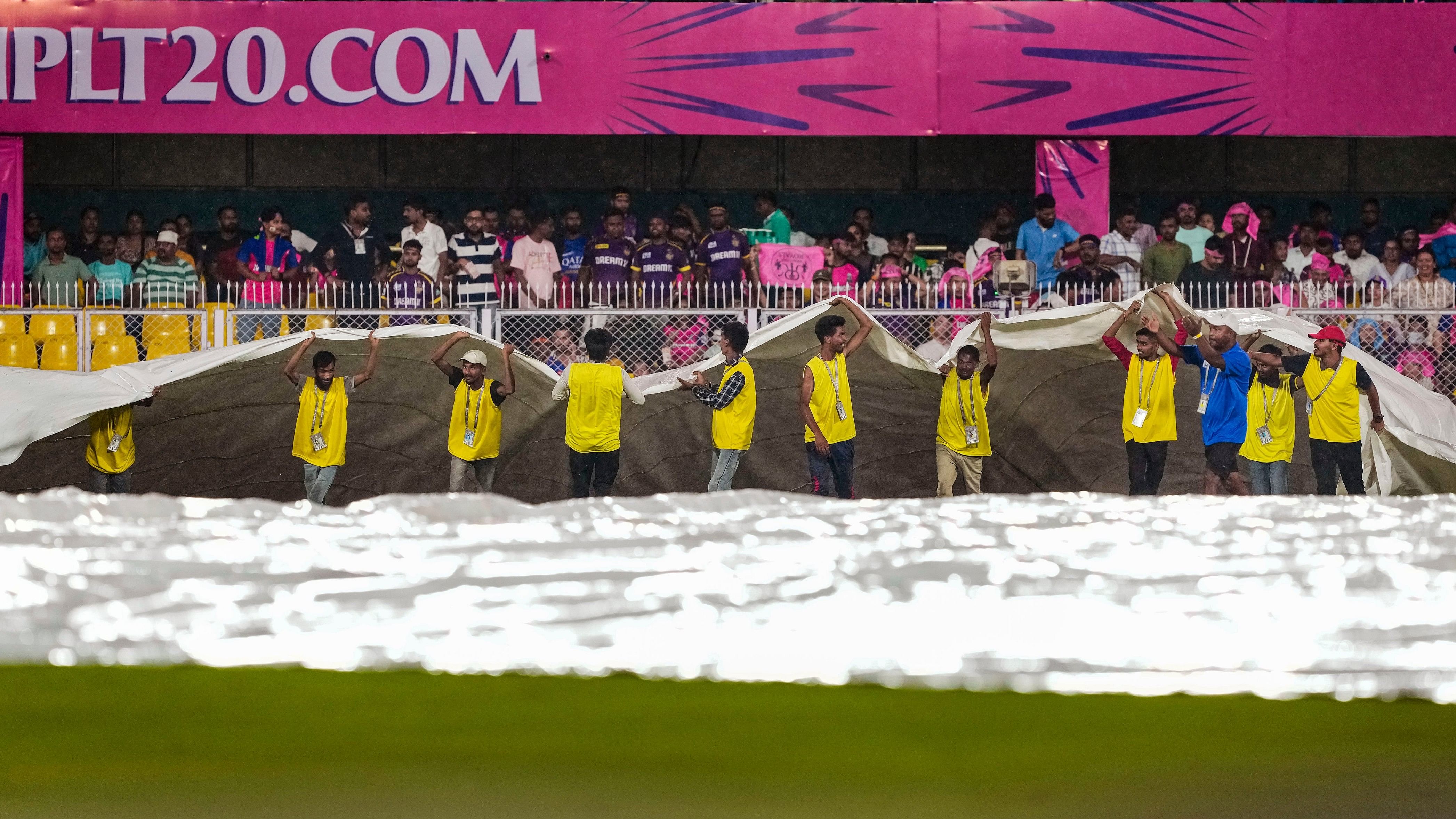 <div class="paragraphs"><p>File Photo: Ground staff bring more covers on the ground as rain delays the Indian Premier League (IPL) 2024 T20 cricket match between Rajasthan Royals (RR) and Kolkata Knight Riders (KKR), at the ACA Stadium, Barsapara, in Guwahati, Sunday, May 19, 2024. </p></div>