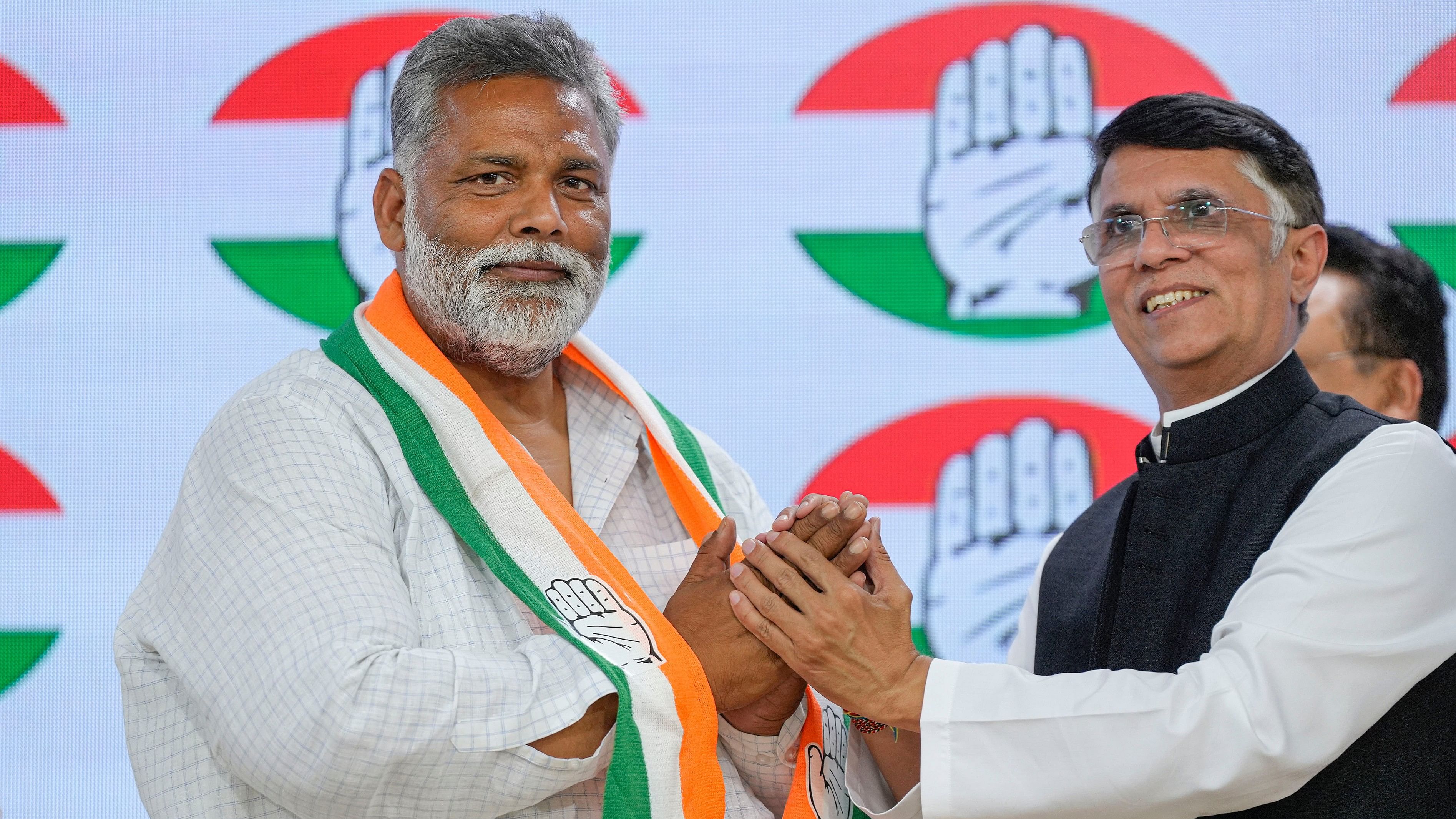 <div class="paragraphs"><p>Jan Adhikar Party chief Pappu Yadav seen here with Congress leader Pawan Khera, at AICC Headquarters in New Delhi, Wednesday, on March 20, when Yadav said he had 'merged' his party with Congress.</p></div>