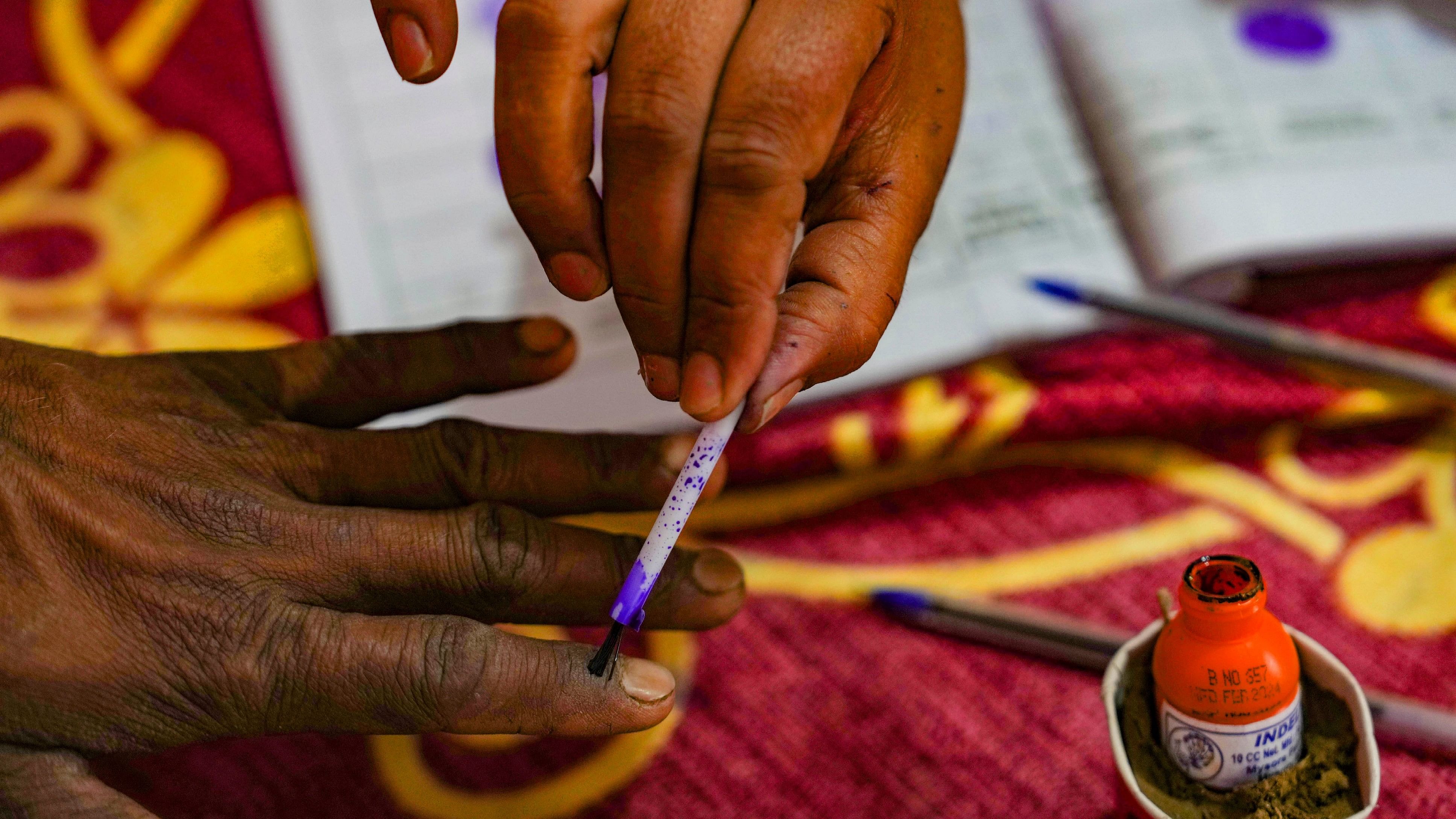 <div class="paragraphs"><p>A voter's finger being marked with indelible ink by a polling official during voting for the third phase of Lok Sabha elections.</p></div>