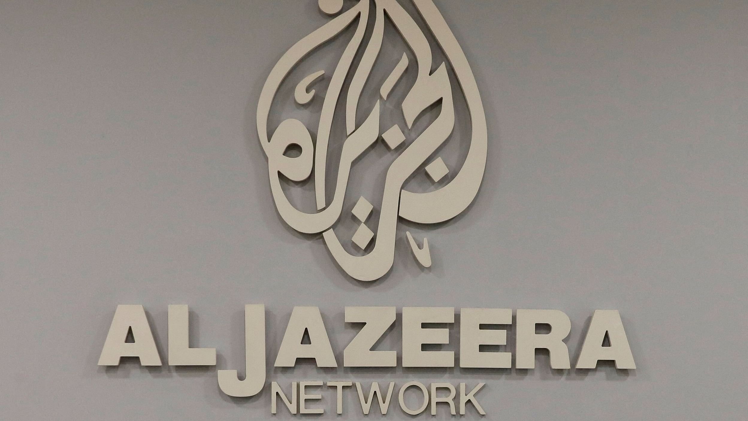 <div class="paragraphs"><p>The logo of Qatar-based Al-Jazeera network is seen in one of their offices in Jerusalem.</p></div>