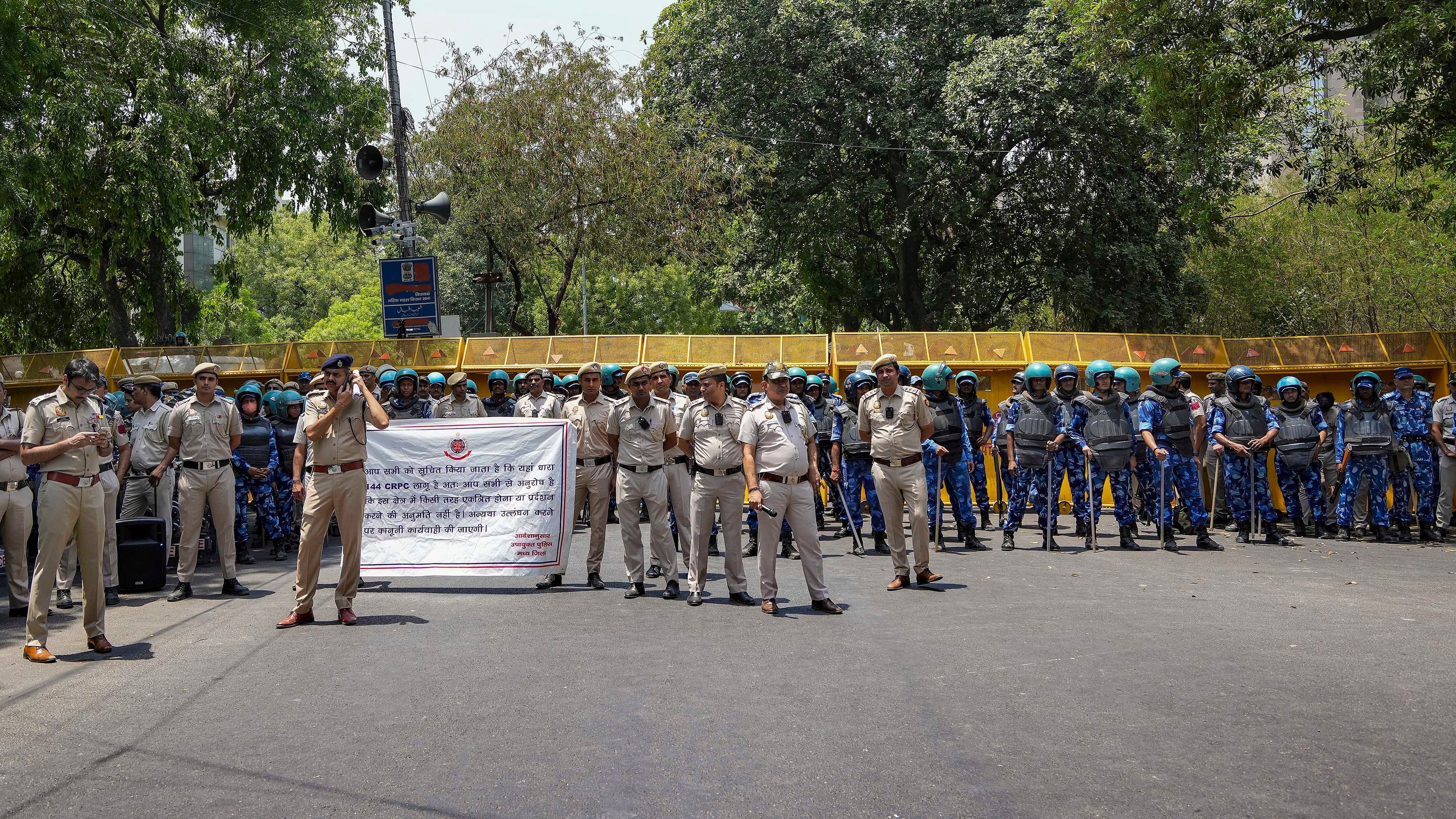 <div class="paragraphs"><p>Police personnel stand guard during AAP's protest march against the arrest of party leaders, in New Delhi, Sunday, May 19, 2024. </p></div>