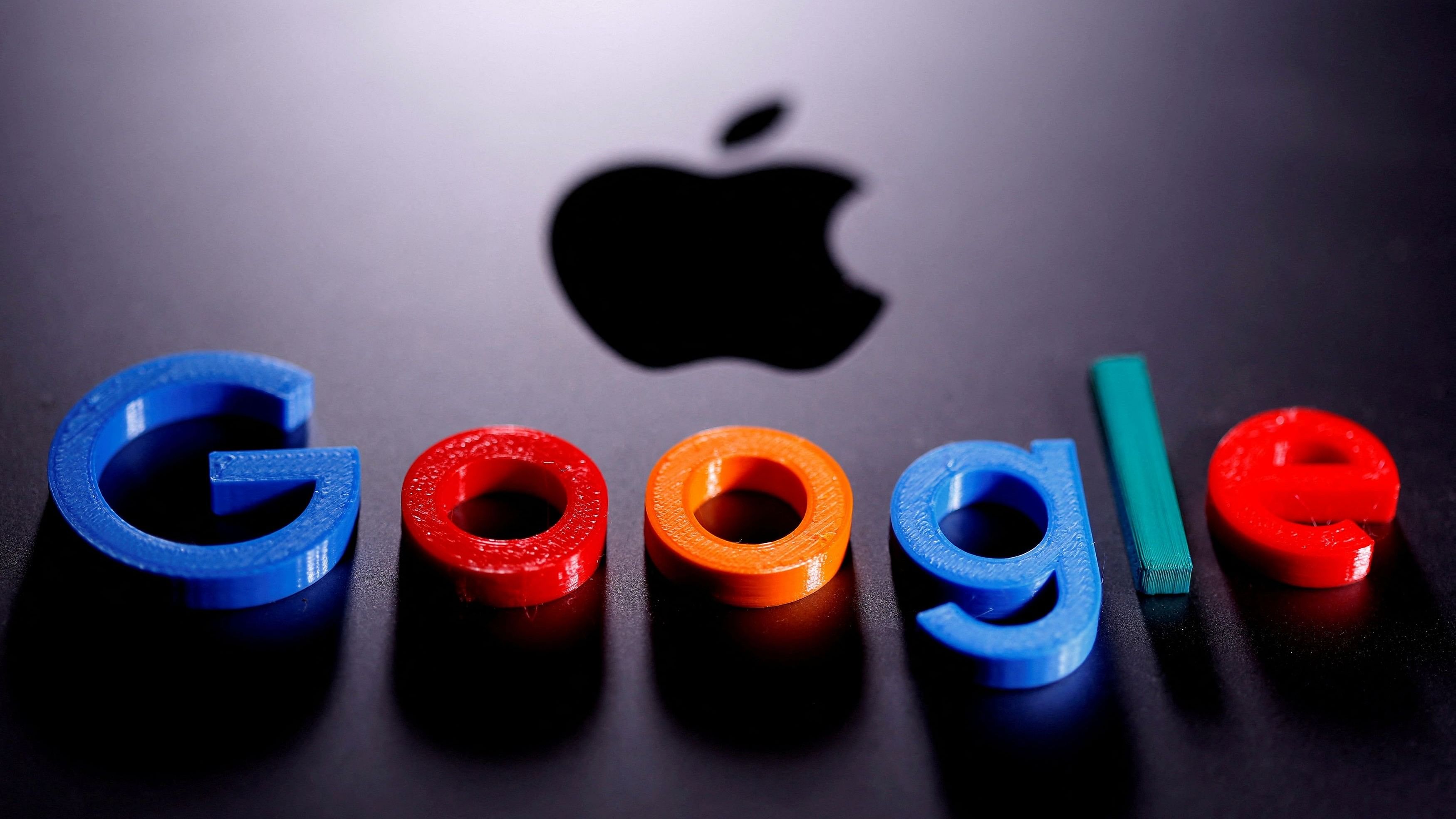 <div class="paragraphs"><p> A 3D printed Google logo is placed on the Apple Macbook in this illustration.</p></div>