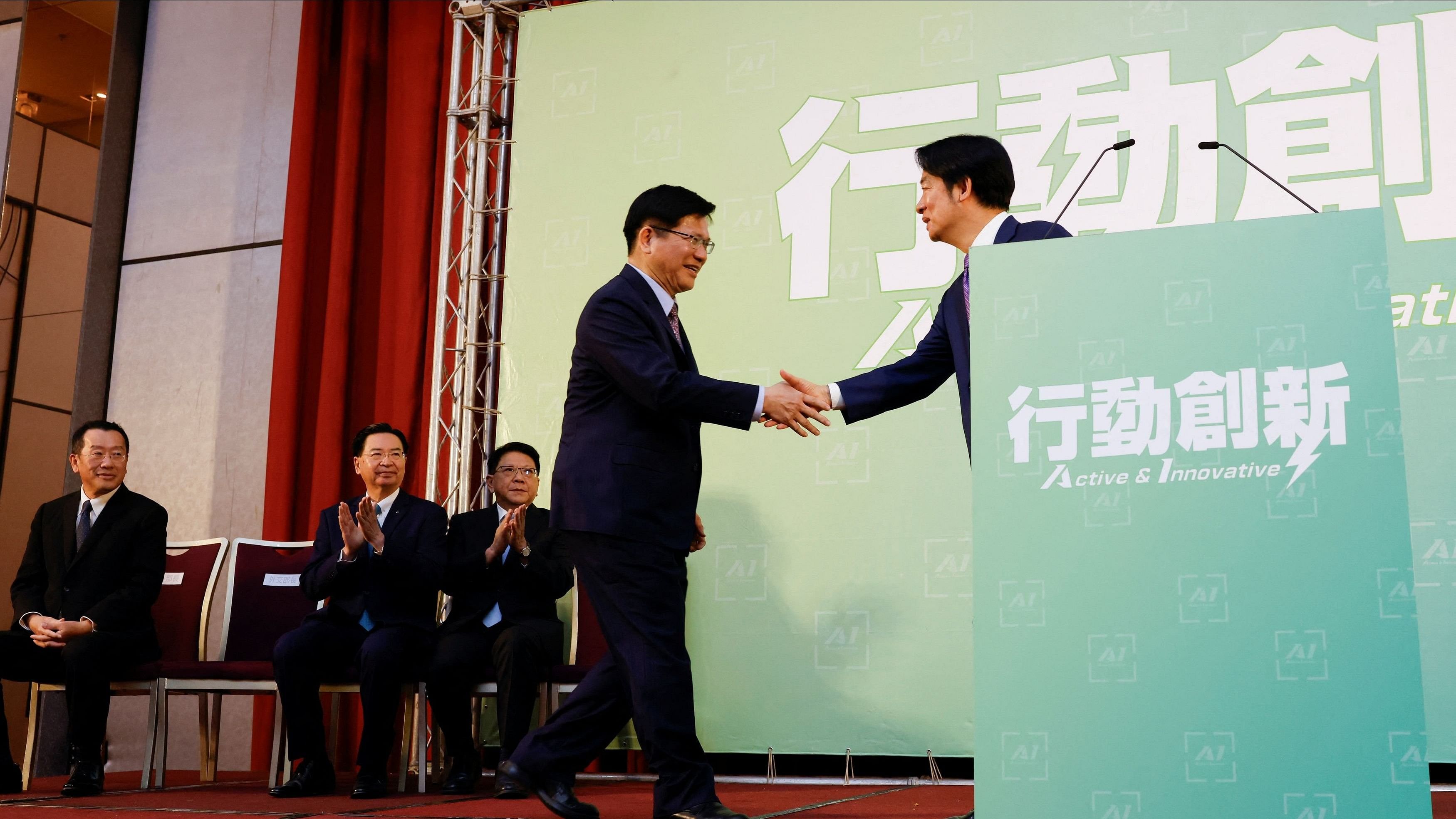 <div class="paragraphs"><p>File Photo: Taiwan President-elect Lai Ching-te and incoming Foreign Minister Lin Chia-lung shake hands during a press conference where incoming cabinet members are announced, in Taipei, Taiwan April 25, 2024. </p></div>