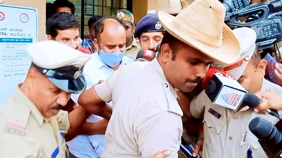 <div class="paragraphs"><p>G Devarajegowda taken for medical examination amidst tight police security in Hassan on Saturday.</p></div>