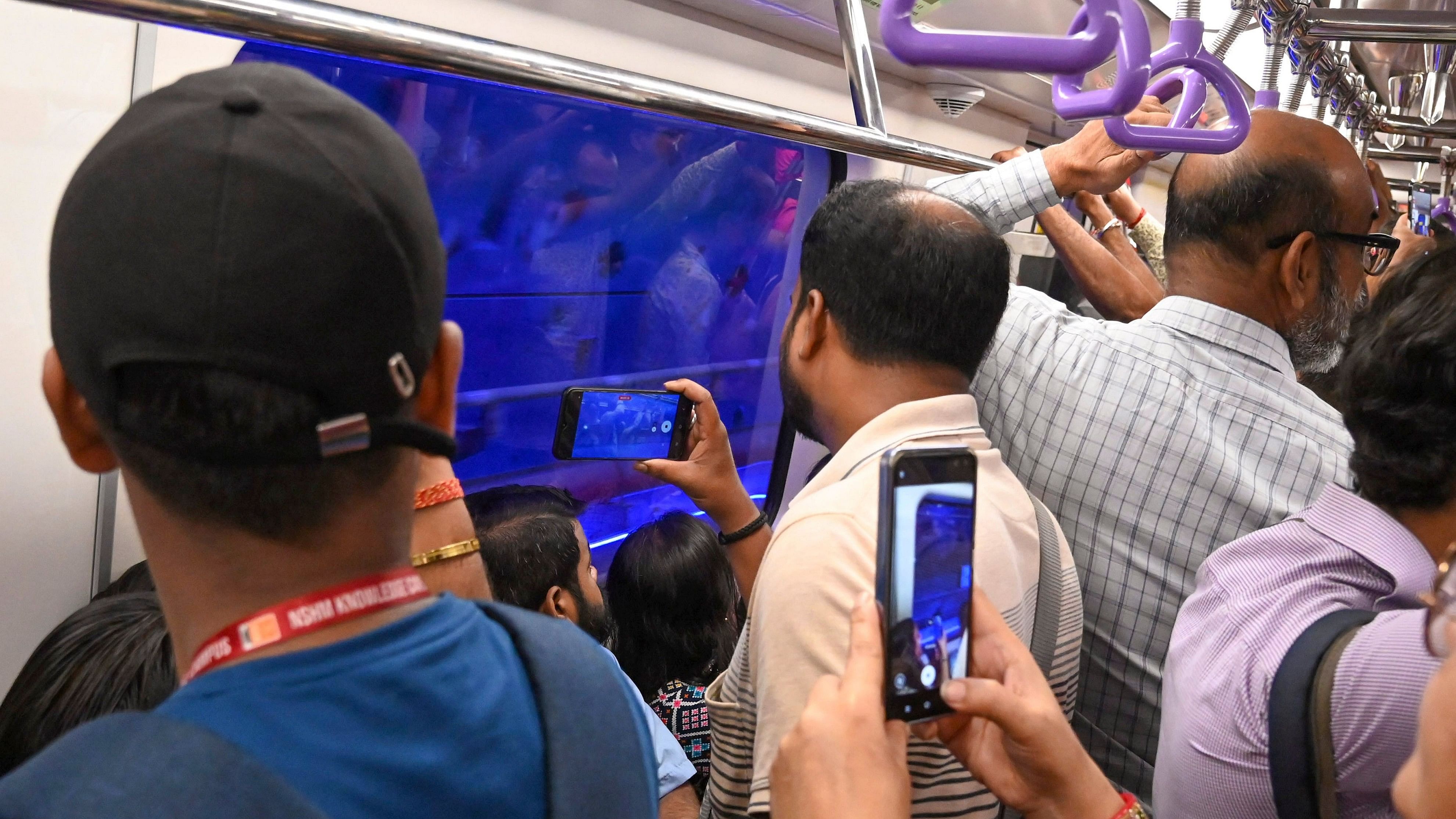 <div class="paragraphs"><p>Kolkata: Commuters click pictures aboard the country's first underwater metro train after its commercial services began, in Kolkata.</p></div>