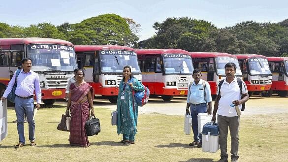 <div class="paragraphs"><p>Polling officials carrying election material leave for their respective polling booths, a day before the voting in the third phase of Lok Sabha elections, in Shivamogga.</p></div>