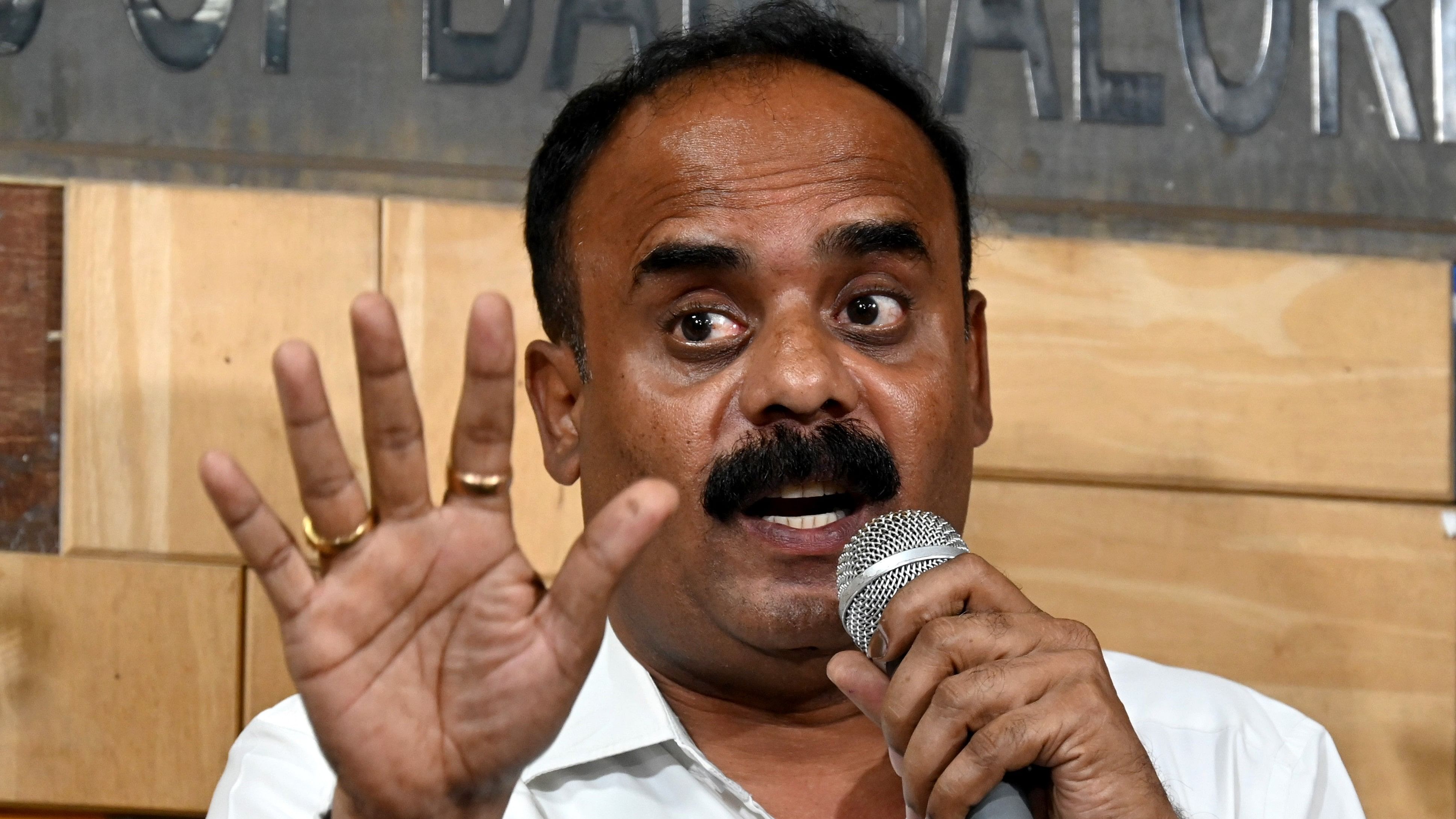 <div class="paragraphs"><p>BJP leader and lawyer G Devarajegowda addresses a press conference regarding the on-going flash drive, sex abuse videos in Bengaluru on Wednesday, May 08, 2024. </p></div>